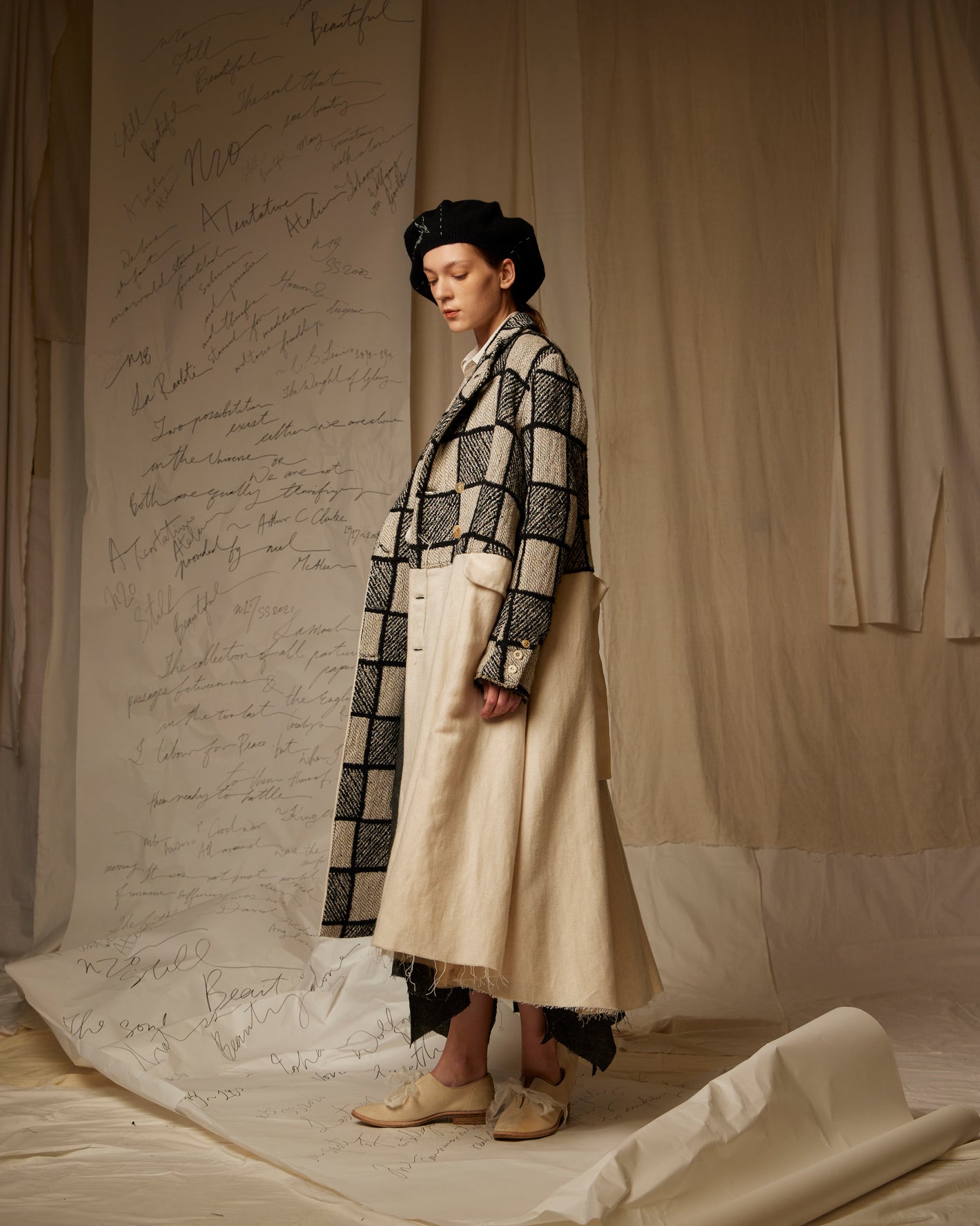 A Tentative Atelier AW22 Lookbook checked and white panel coat