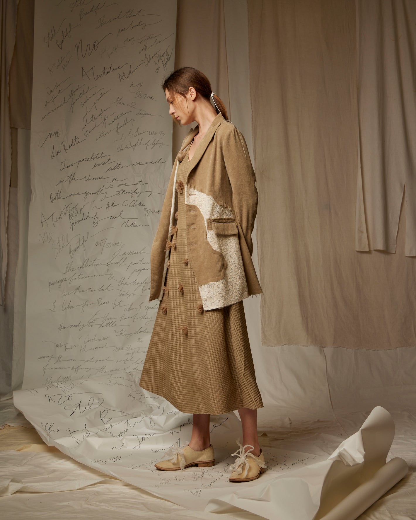 A Tentative Atelier SS23 Lookbook Womens brown patchwork jacket and brown check long dress ensemble