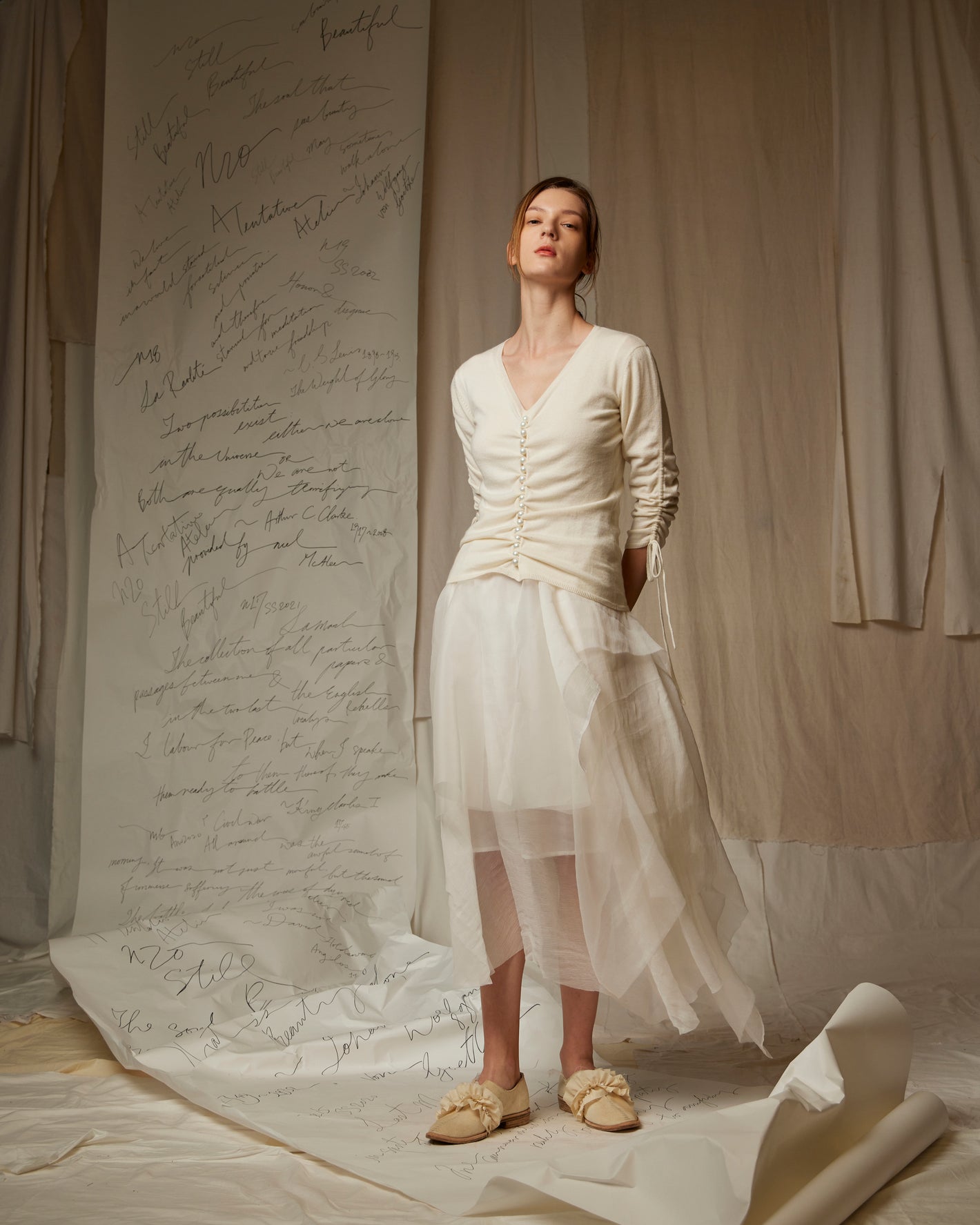 A Tentative Atelier SS23 Lookbook Womens cream ruched body top with ruched sleeves and a layered white tulle skirt ensemble