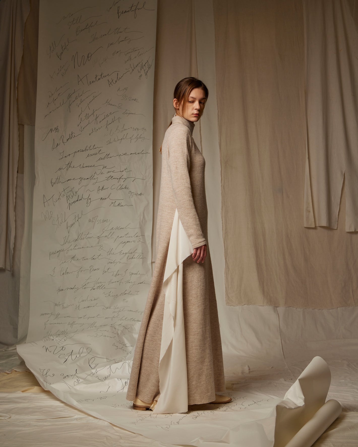 A Tentative Atelier SS23 Lookbook Womens floor length beige turtle neck knit dress with side appliqué