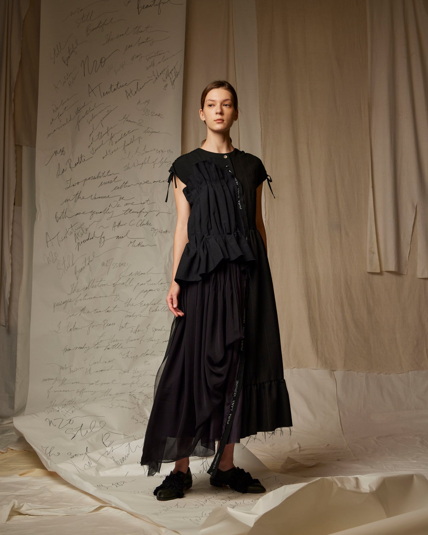 A Tentative Atelier SS23 Lookbook Womens black ruched t-shirt and black draped skirt ensemble