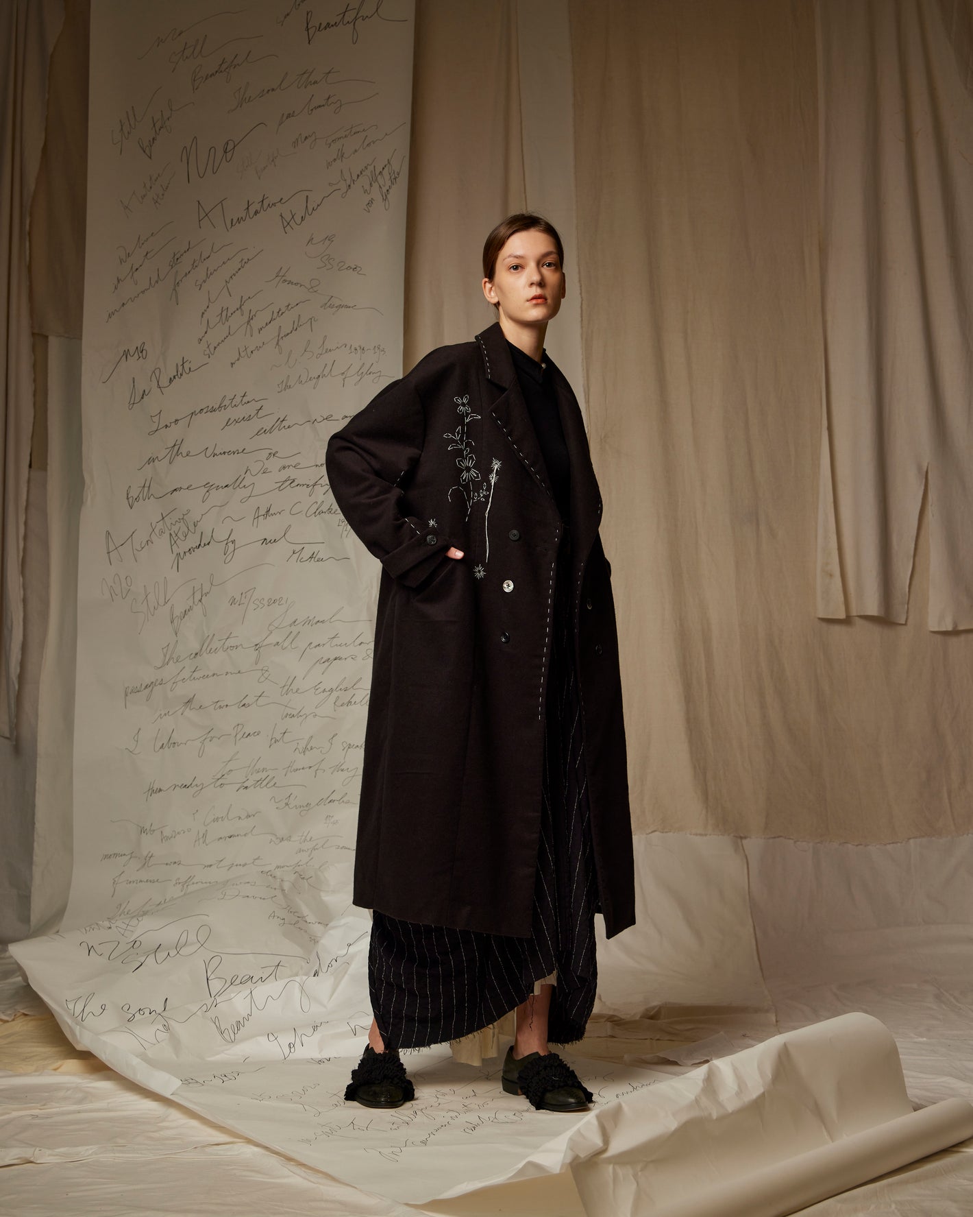 A Tentative Atelier AW22 Lookbook black embroidered coat