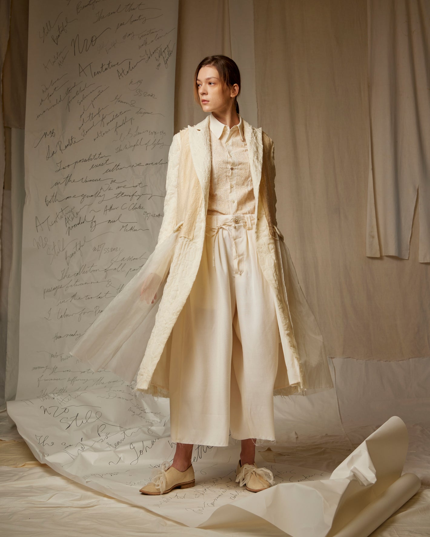 A Tentative Atelier SS23 Lookbook Womens cream layered coat with a semi-sheer skirt