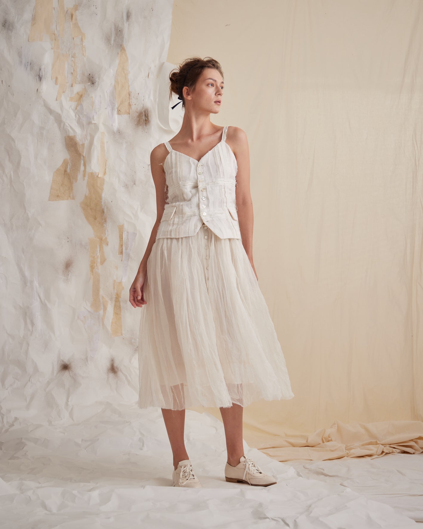 A Tentative Atelier SS23 Lookbook Womens white strap button-up top and layered tulle skirt ensemble