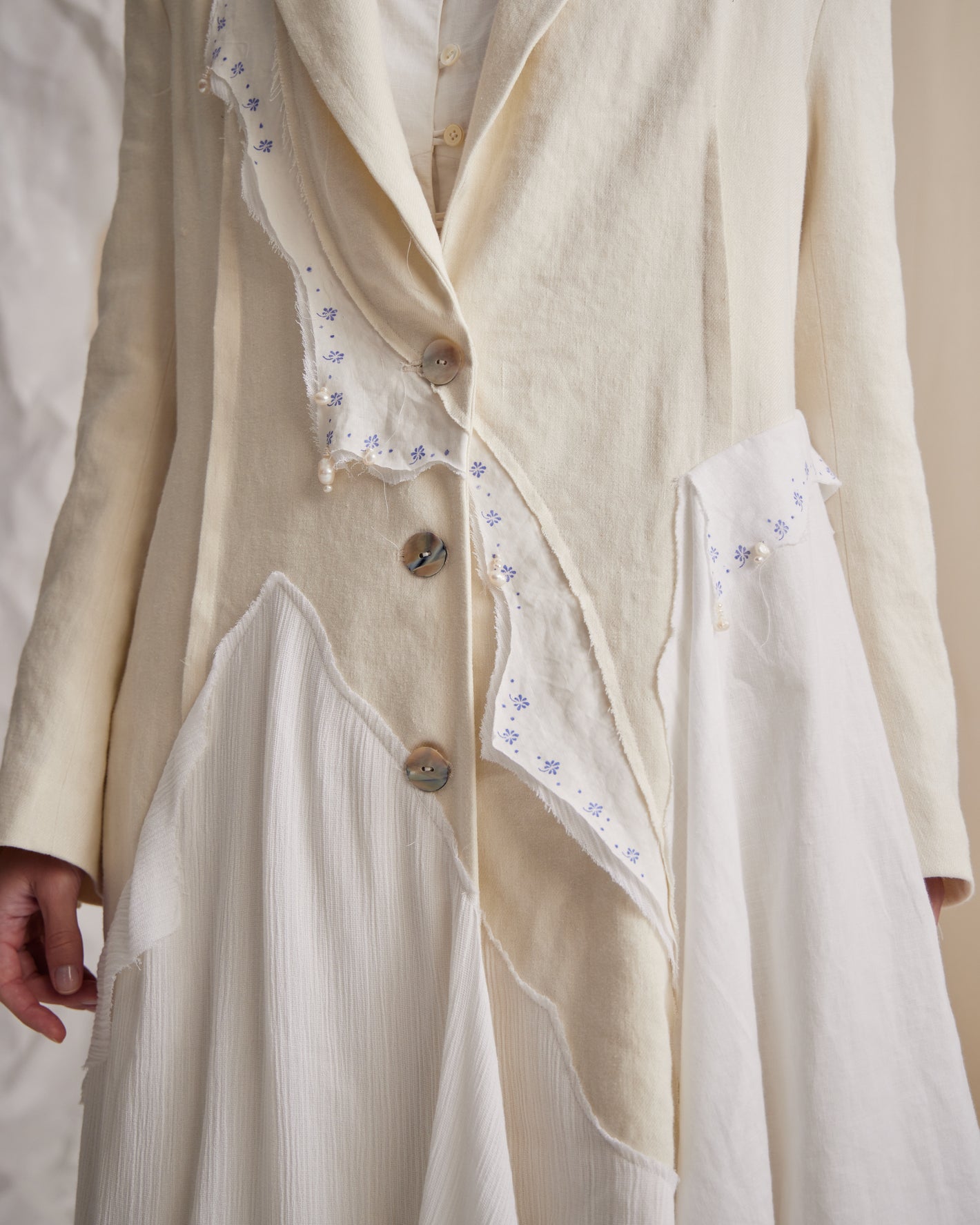 A Tentative Atelier SS23 Lookbook crop of a cream patchwork coat