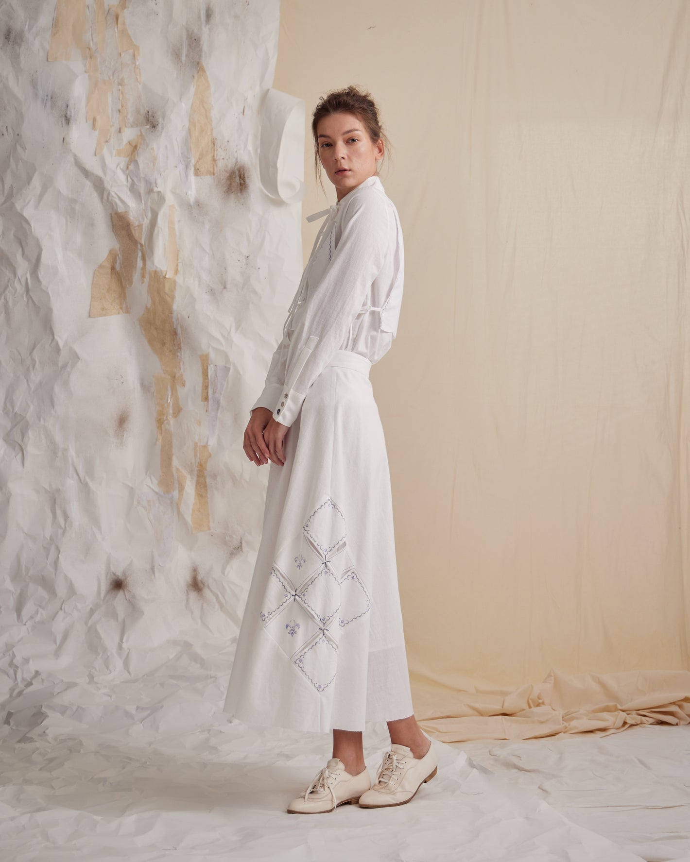 A Tentative Atelier SS23 Lookbook Womens white shirt and white embroidered skirt ensemble