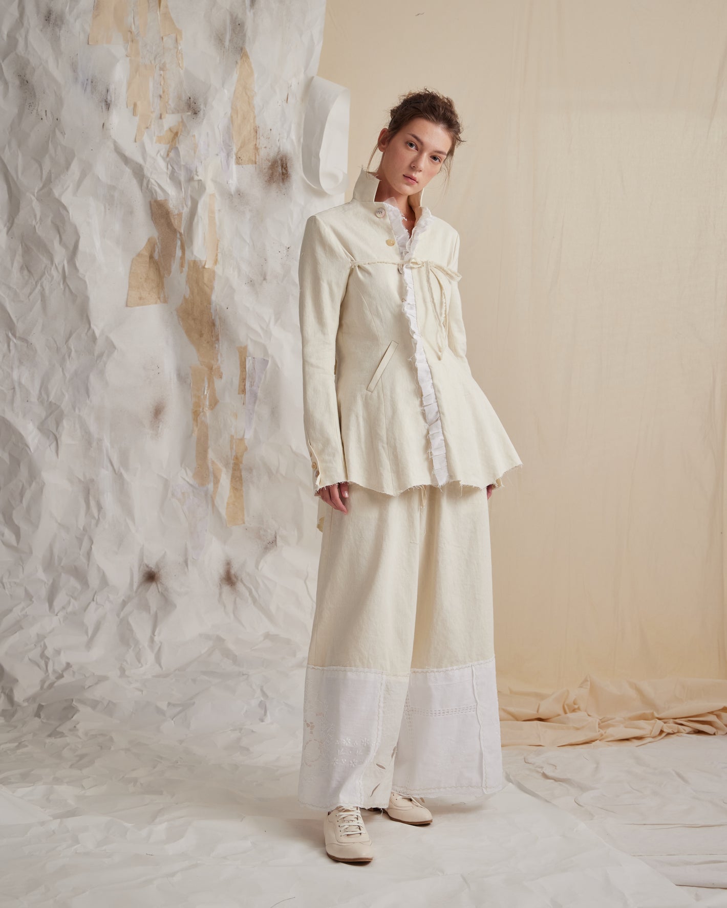 A Tentative Atelier SS23 Lookbook Womens cream high collar ruffle jacket and trouser ensemble