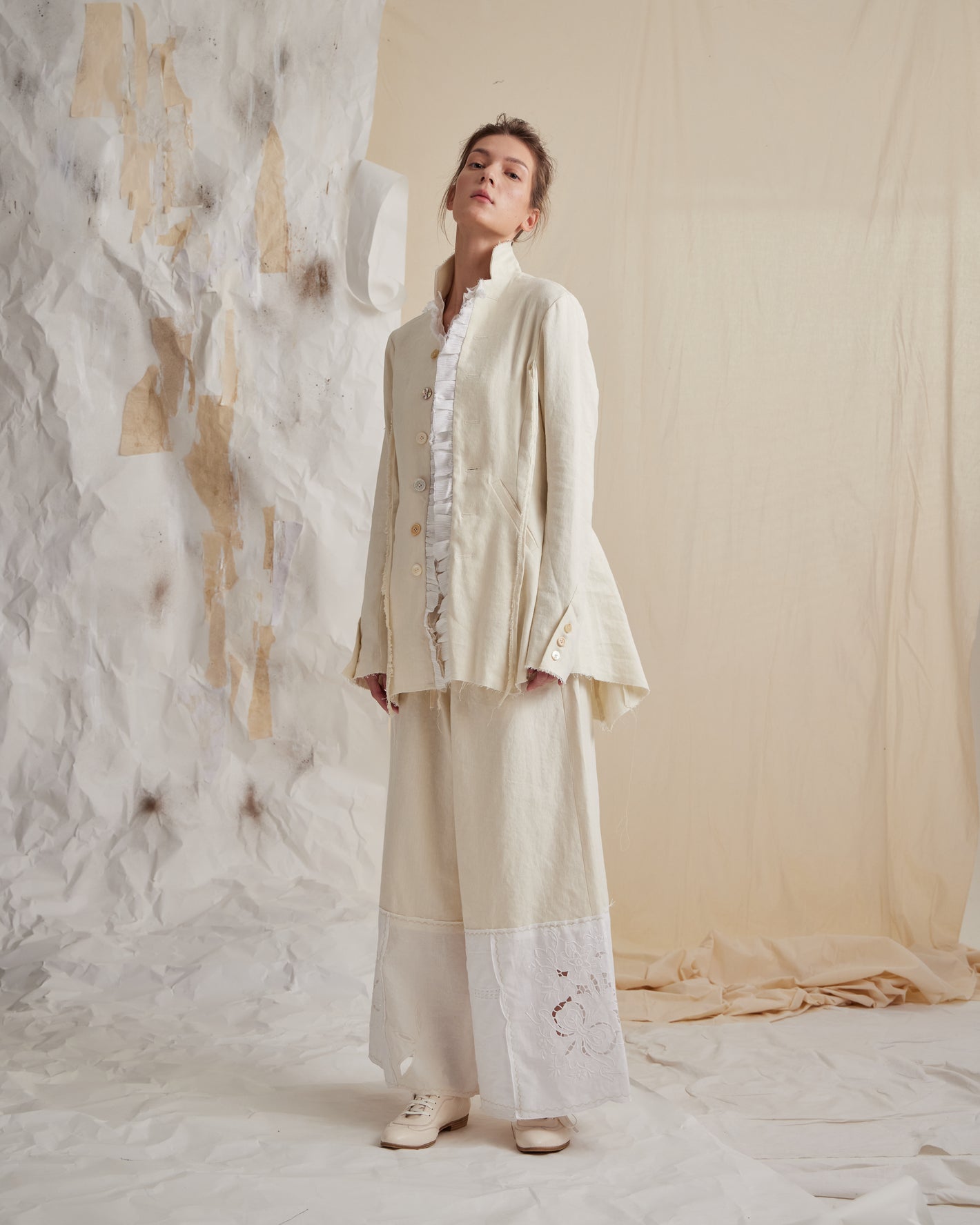 A Tentative Atelier SS23 Lookbook Womens cream suit with embroidered white contrast hem trousers