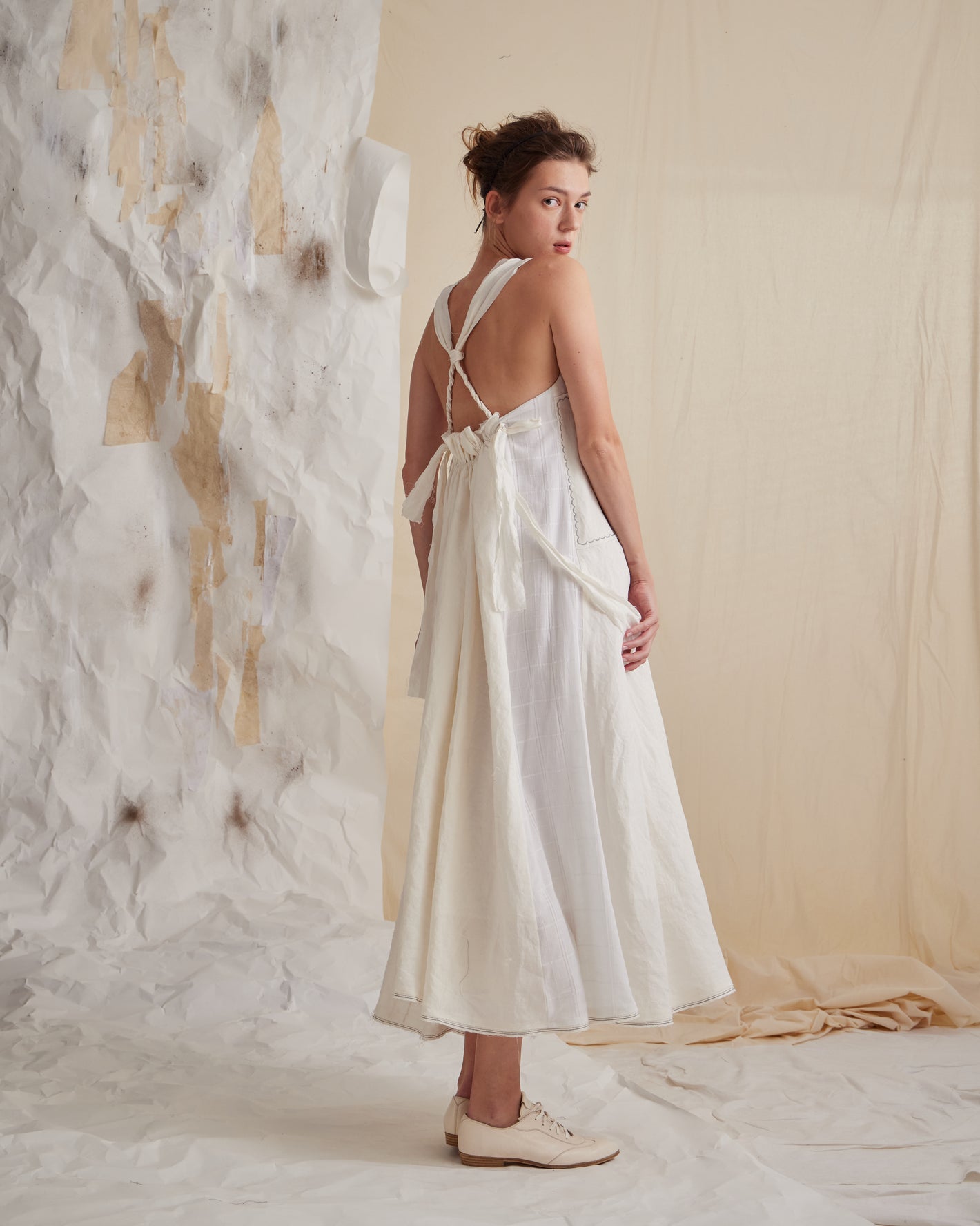 A Tentative Atelier SS23 Lookbook Womens long white strap dress with a criss cross back 