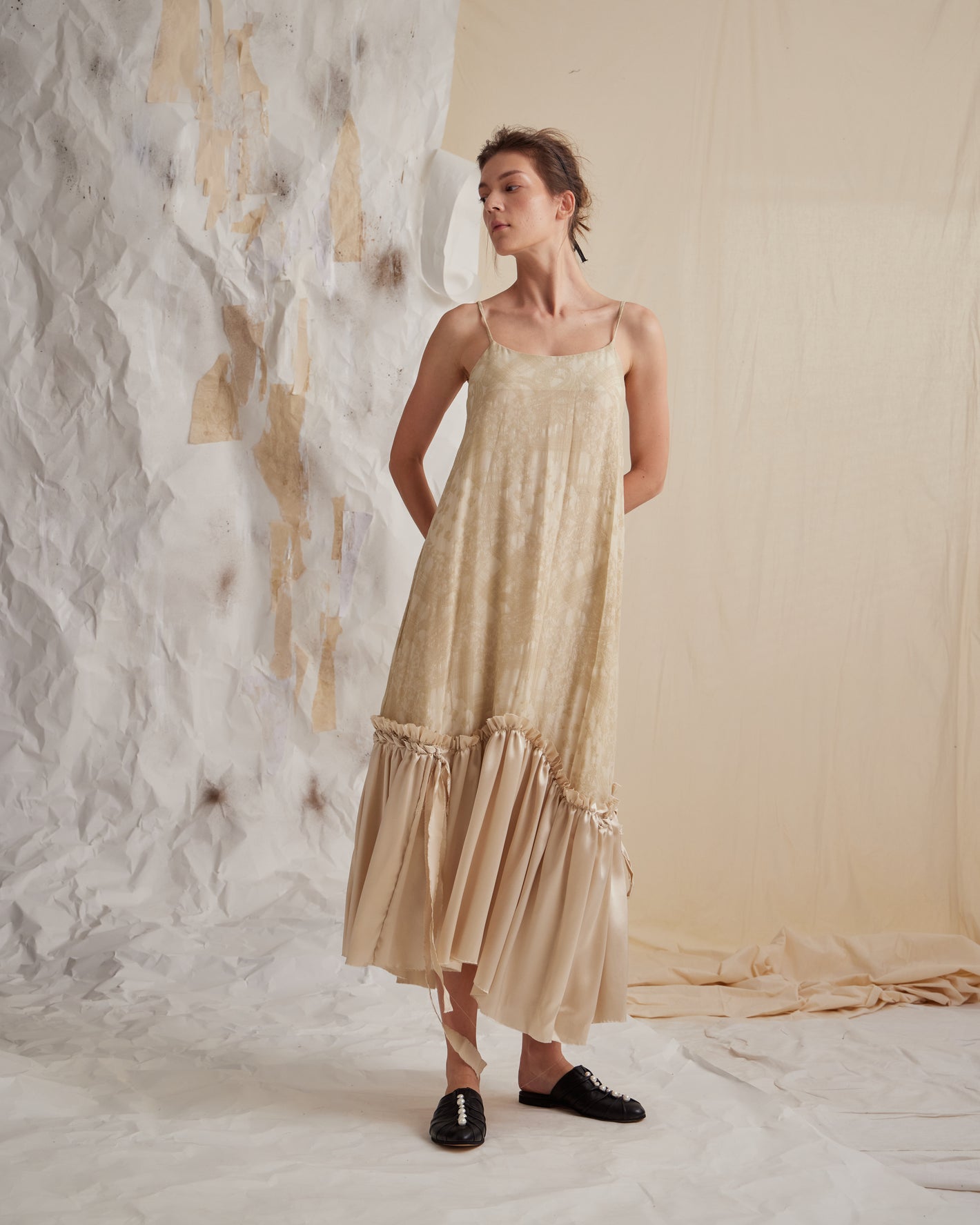 A Tentative Atelier SS23 Lookbook Womens beige slip dress with a silk gathered hem