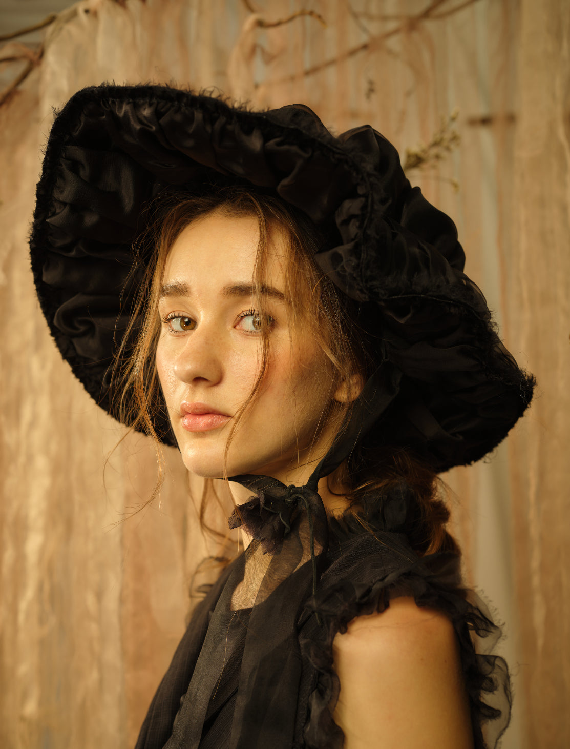 A Tentative Atelier SS21 Lookbook Womens crop of a black silk bonnet