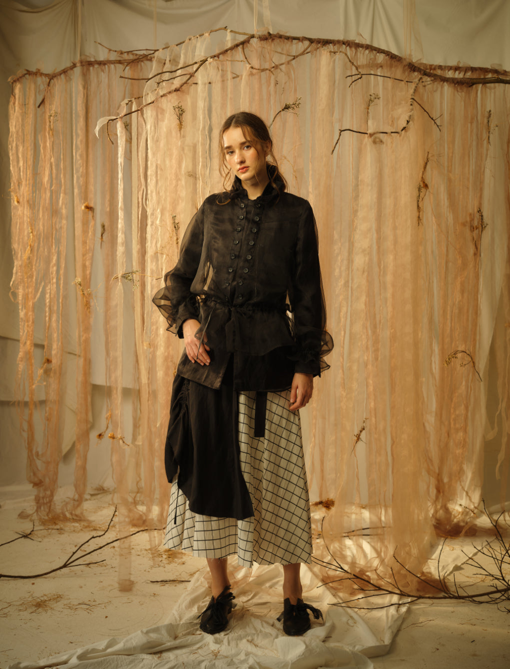 A Tentative Atelier SS21 Lookbook Womens black organza top with buttons and gathered sleeves, and a white check skirt