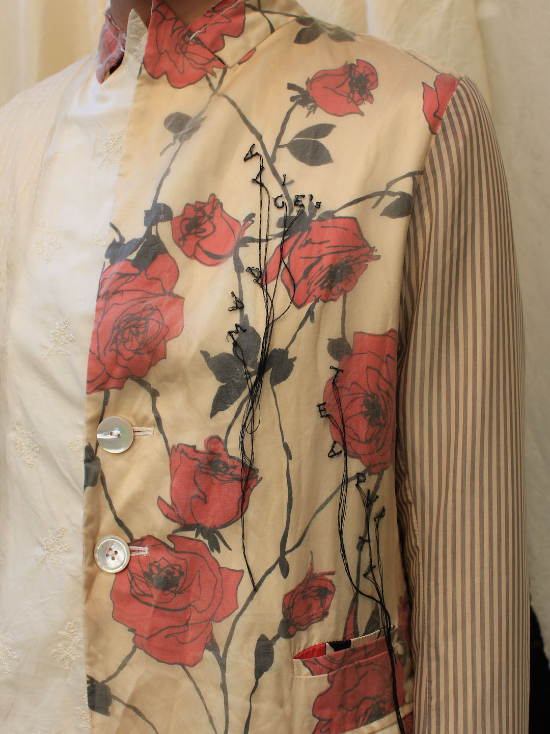 A Tentative Atelier SS24 Lookbook detail, rose print shirt overlaid with hand embroidery