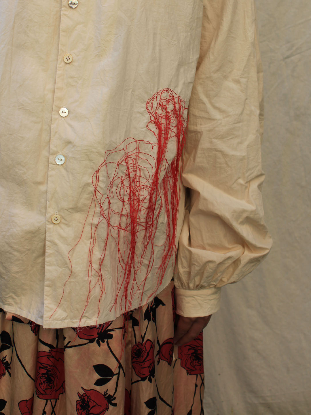 A Tentative Atelier SS24 Lookbook, detail of rose embroidery using red thread