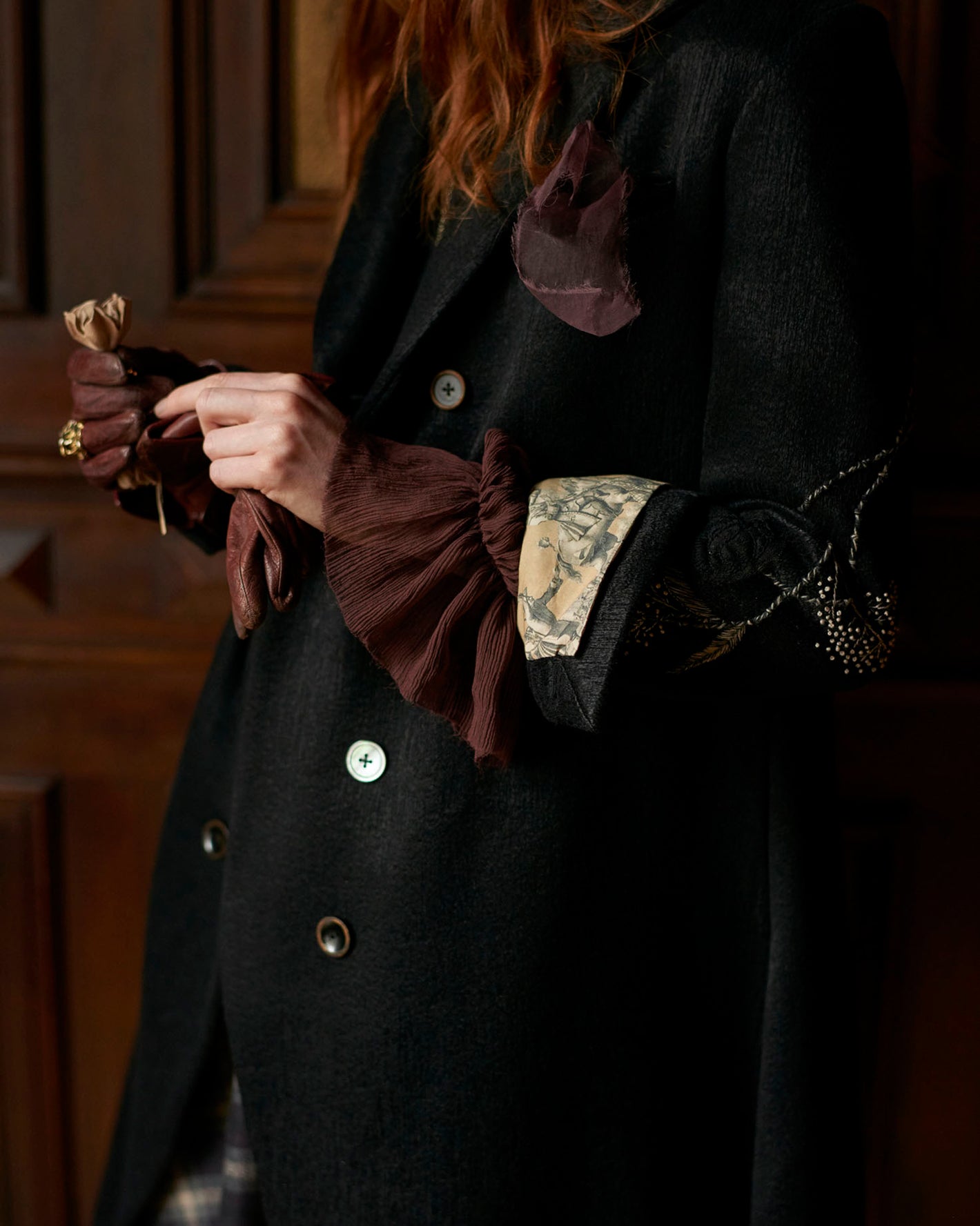 A Tentative Atelier AW20 Lookbook Womens crop of rusty red ruffle sleeves top and black coat
