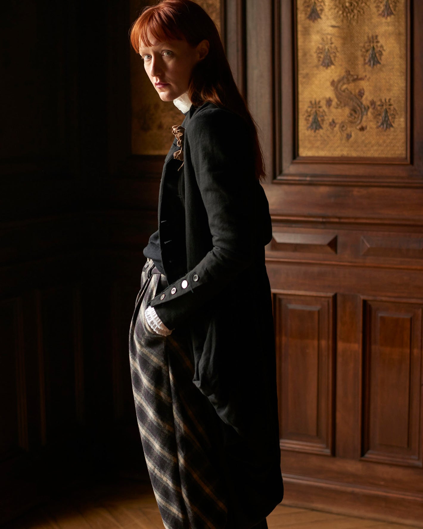 A Tentative Atelier AW20 Lookbook Womens crop of a black coat and check trousers