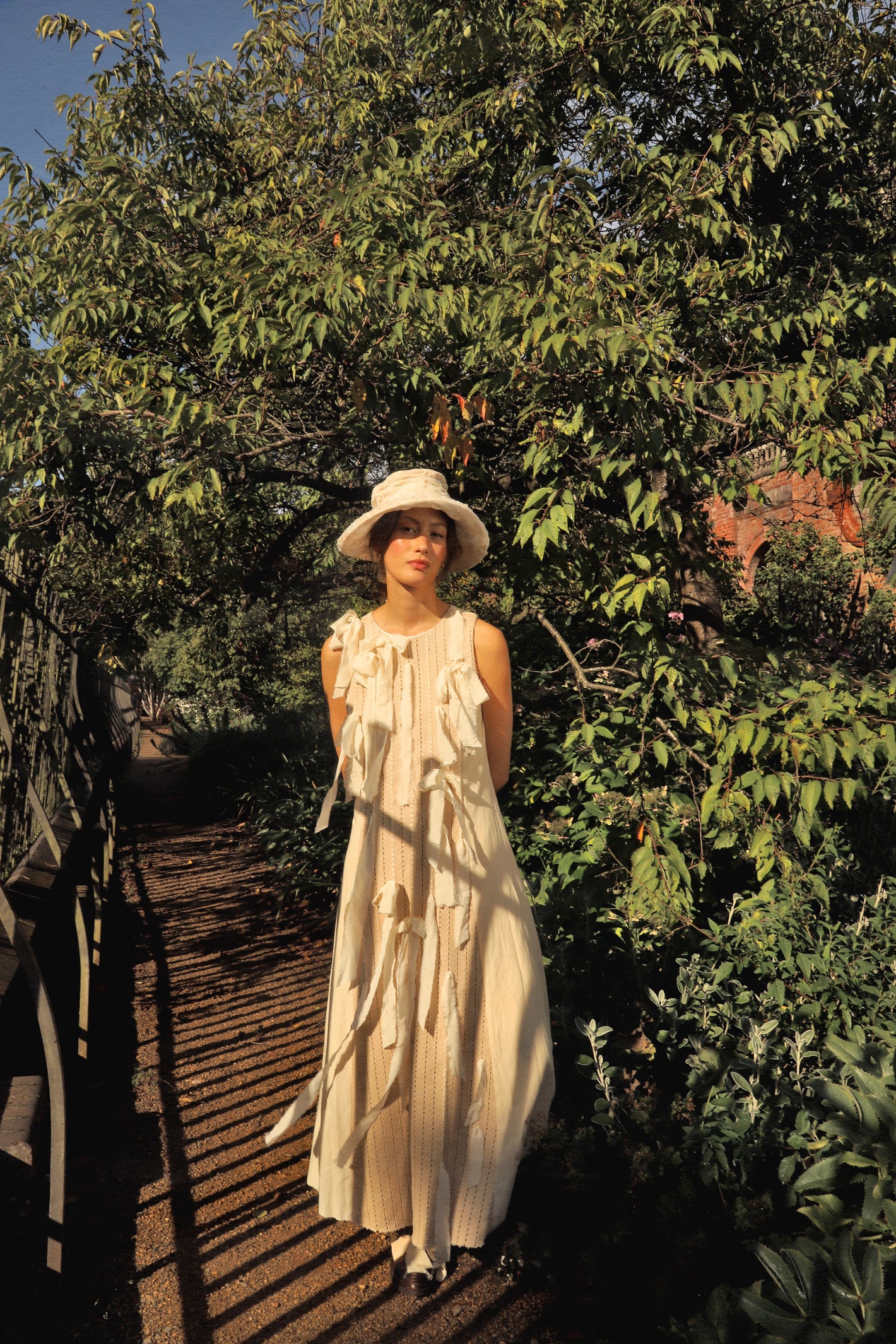 A Tentative Atelier SS24 Lookbook Womens cream maxi dress with ribbons