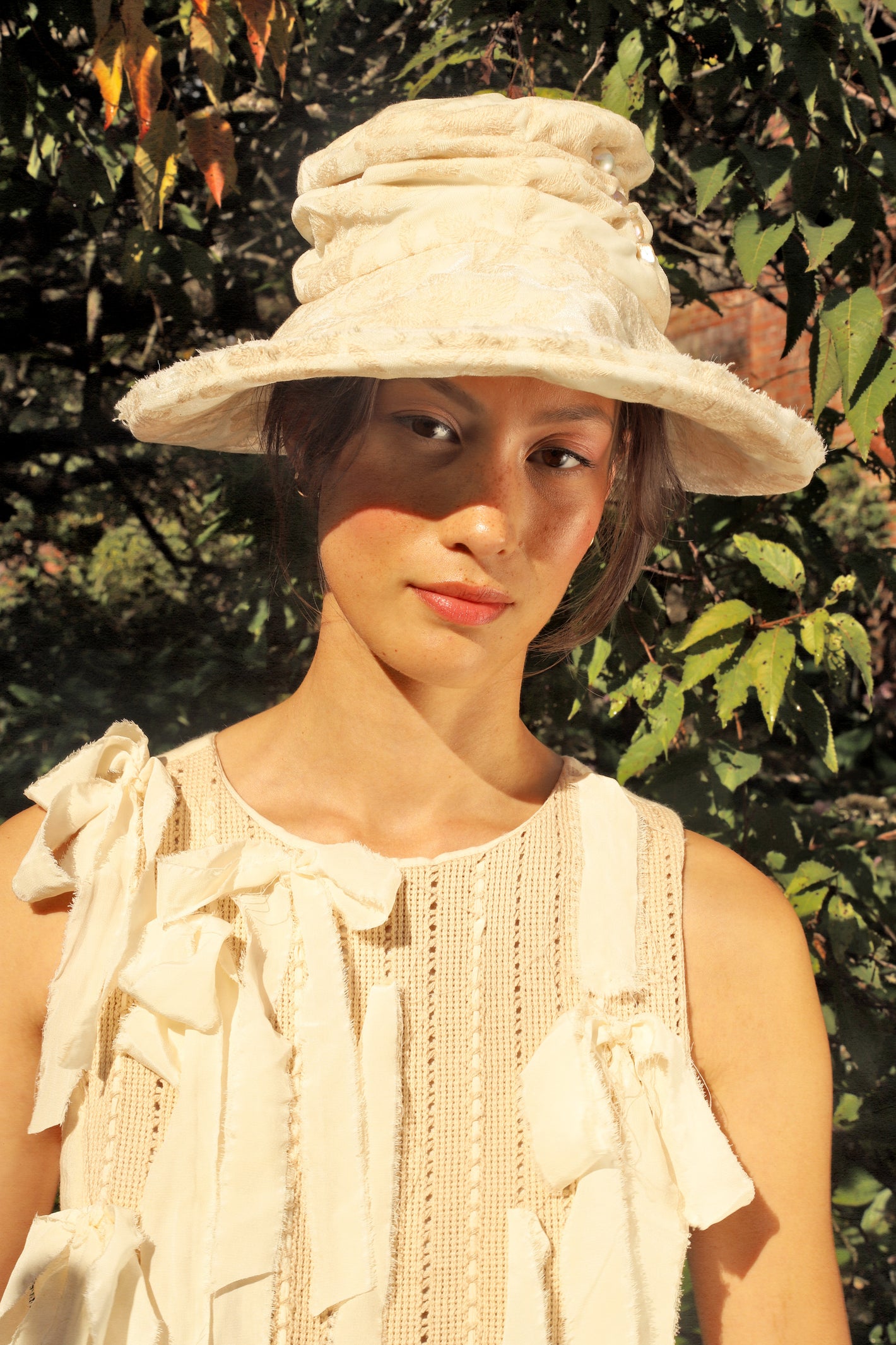 A Tentative Atelier SS24 Lookbook Womens crop of cream ribbons dress and hat