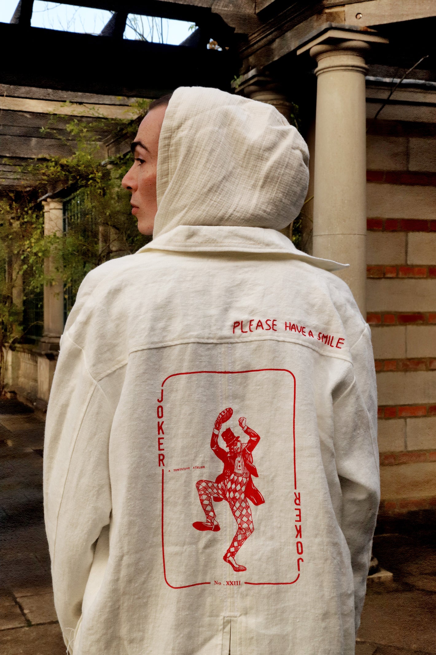 A Tentative Atelier SS24 Lookbook Mens white Joker print shirt-jacket, crop of the back