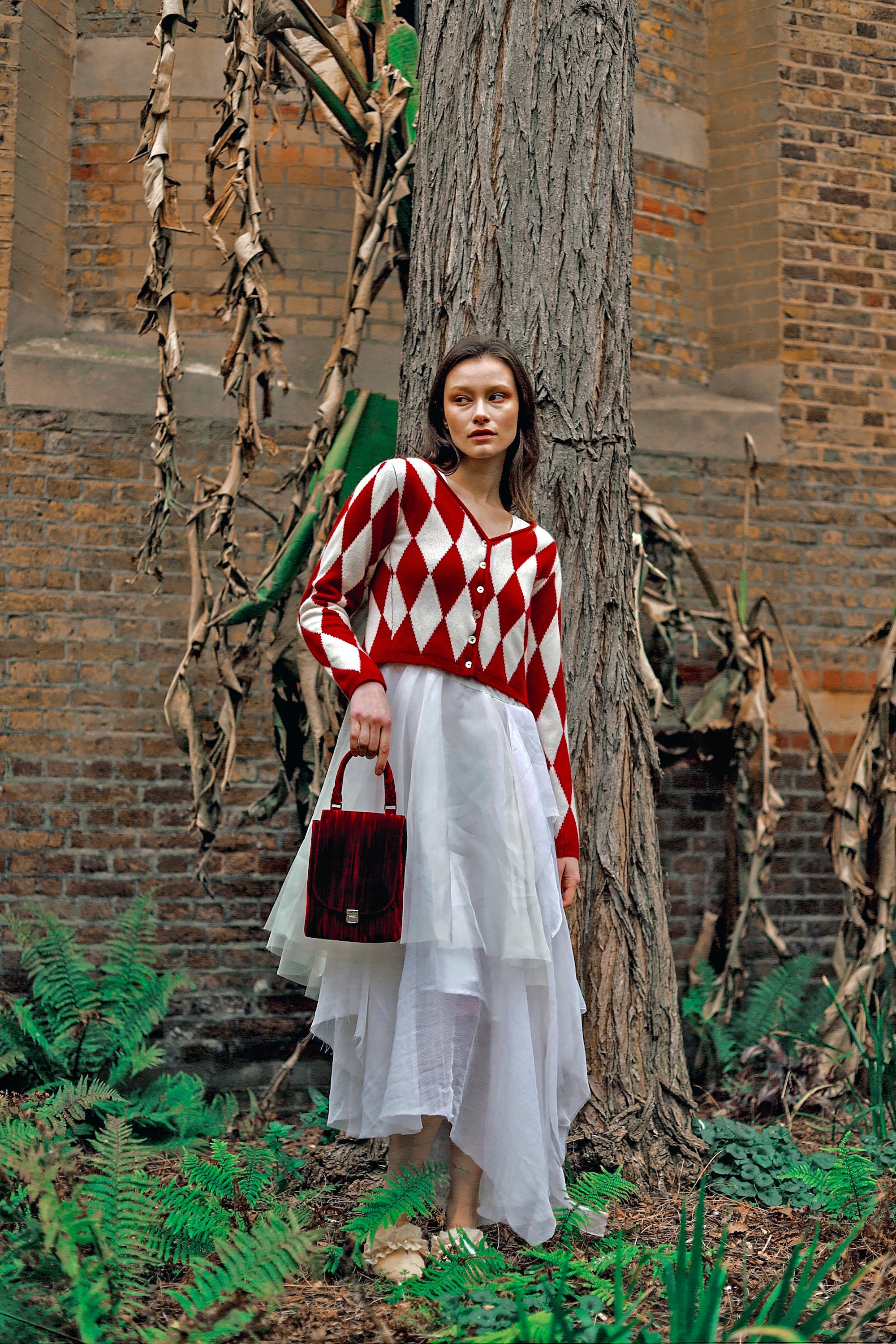 A Tentative Atelier AW23 Lookbook Womens diamond knit cardigan and red velvet top handle bag