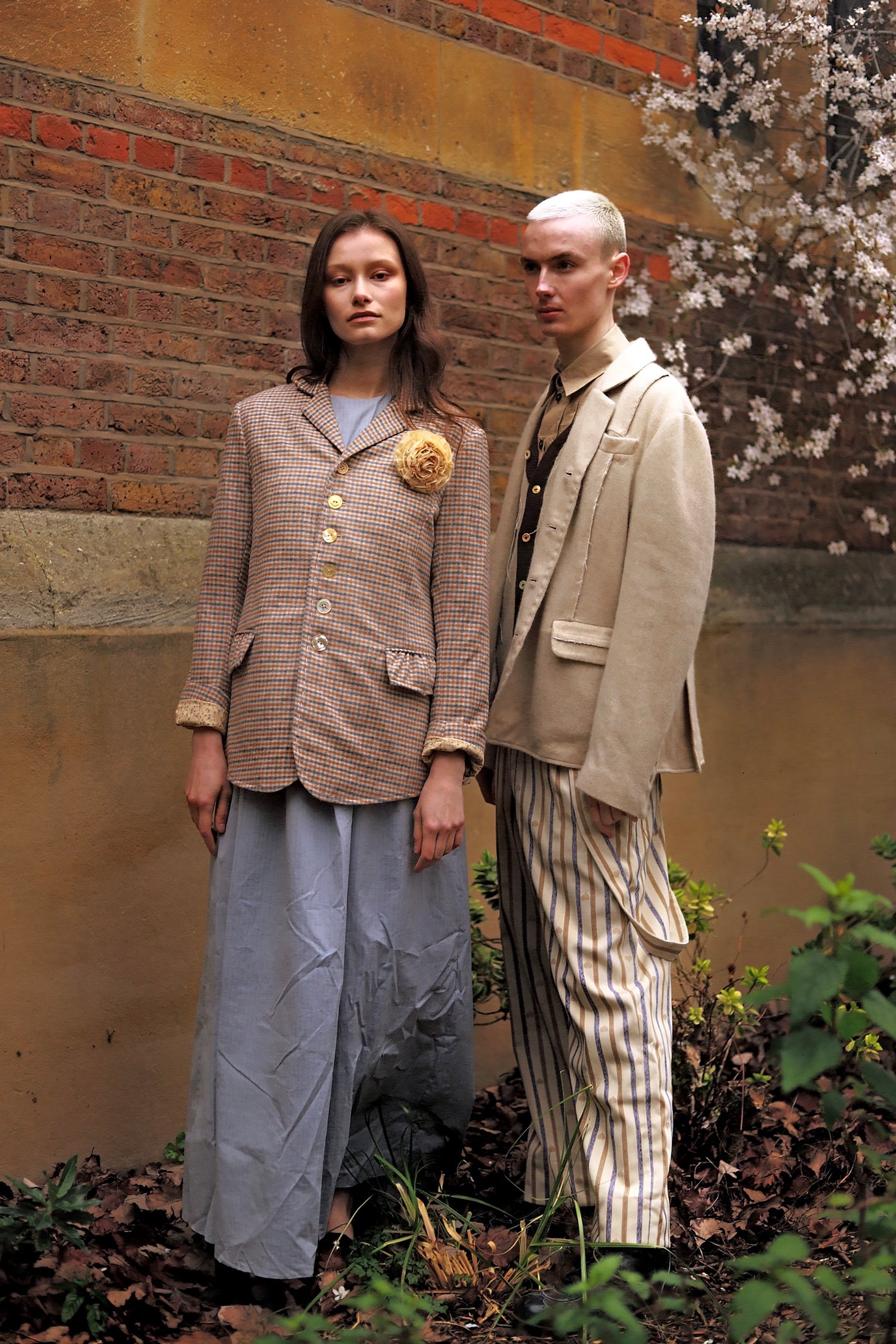 A Tentative Atelier AW23 Lookbook Womens check jacket and Mens beige jacket with stripe pants