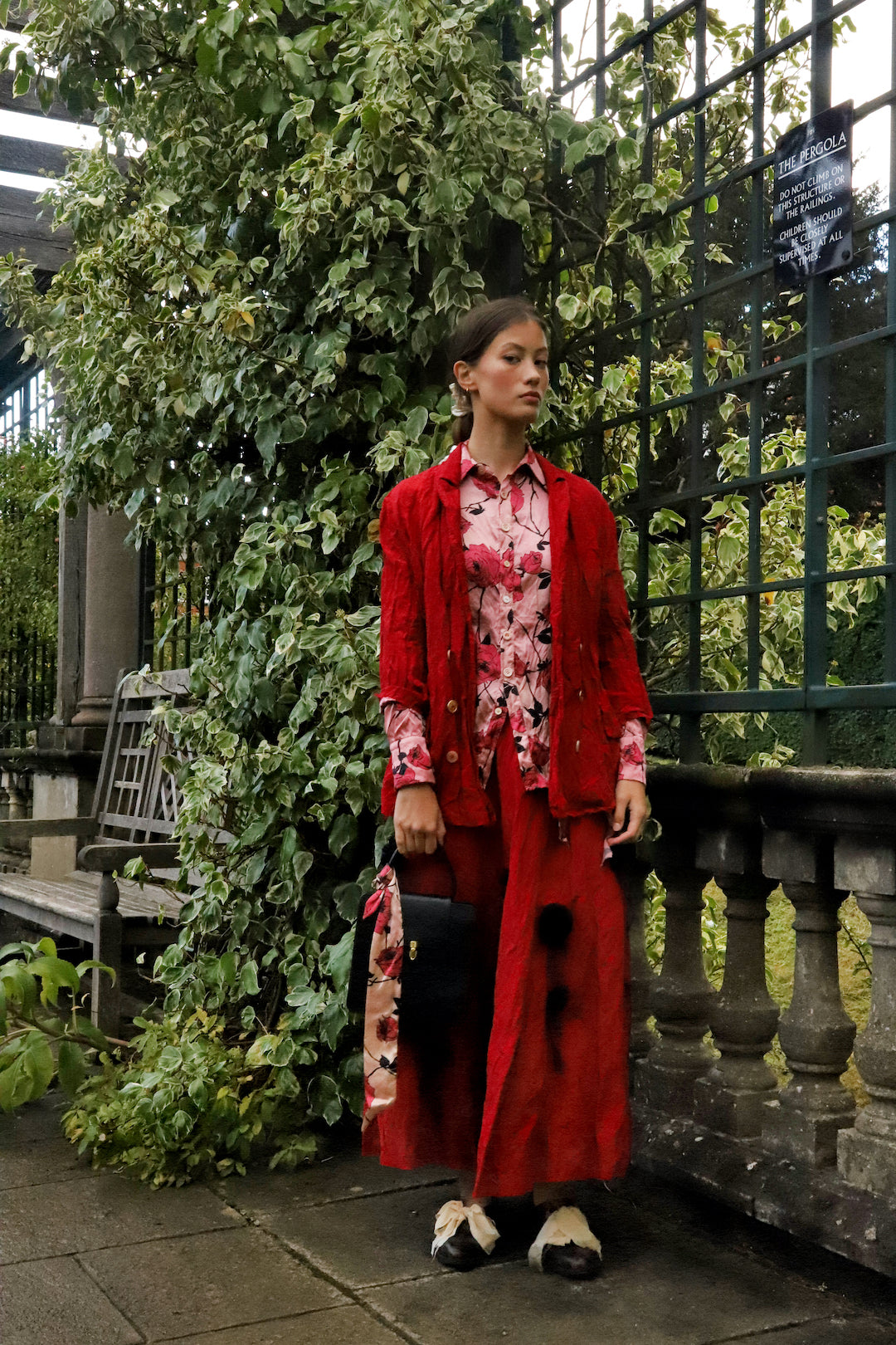 A Tentative Atelier SS24 Lookbook detail, red jacket and skirt with pink rose print shirt