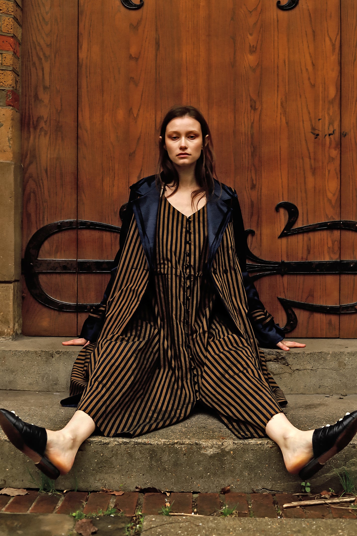 A Tentative Atelier AW23 Lookbook Womens black and brown striped coat and dress ensemble