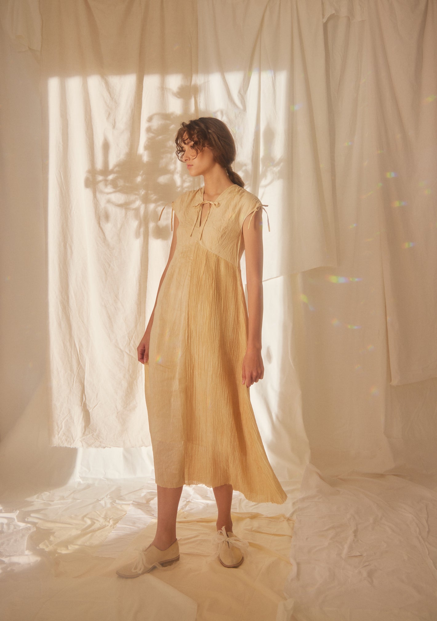 A Tentative Atelier SS22 Lookbook pleated tie ribbons dress in orange