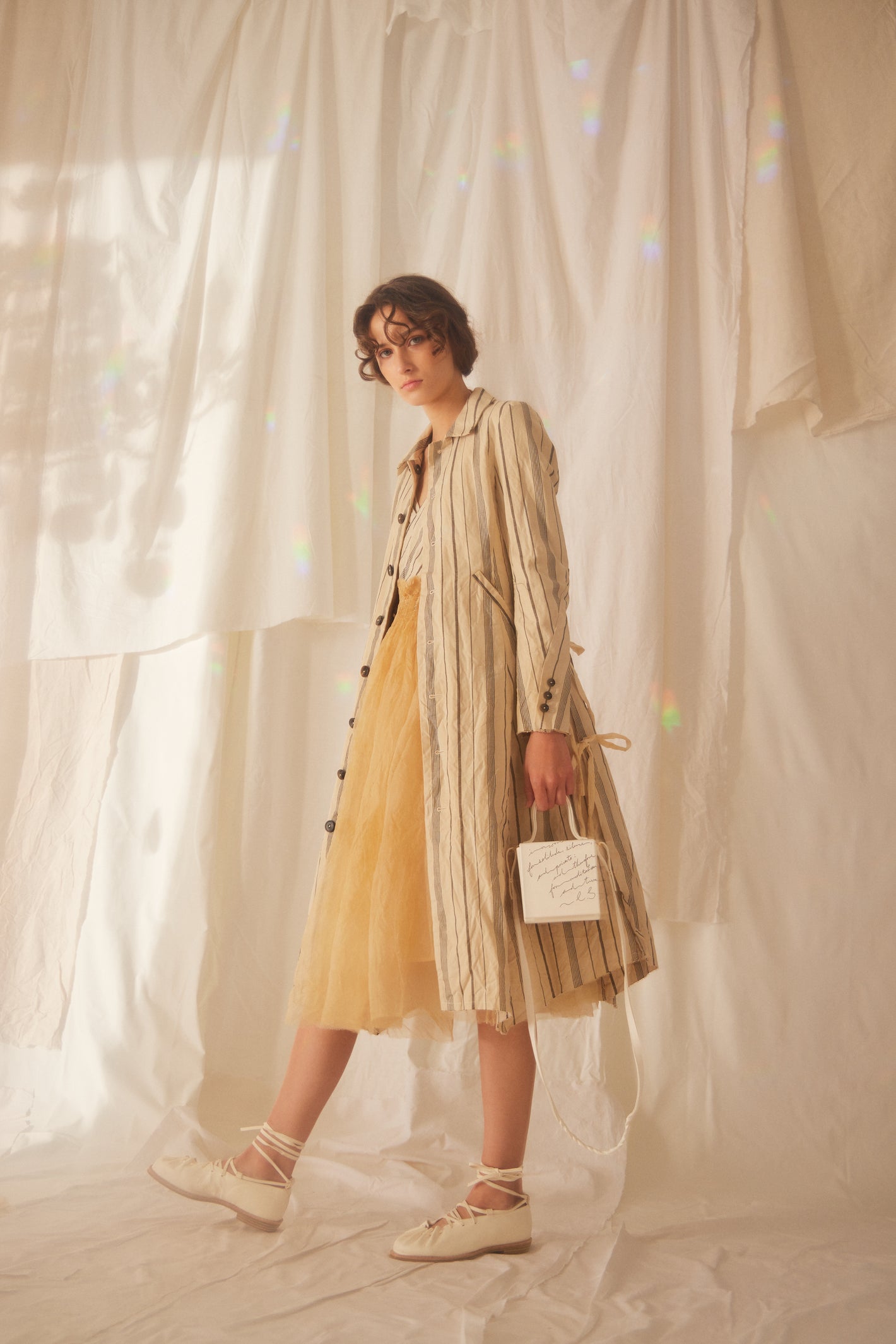 A Tentative Atelier SS22 Lookbook striped beige and black coat