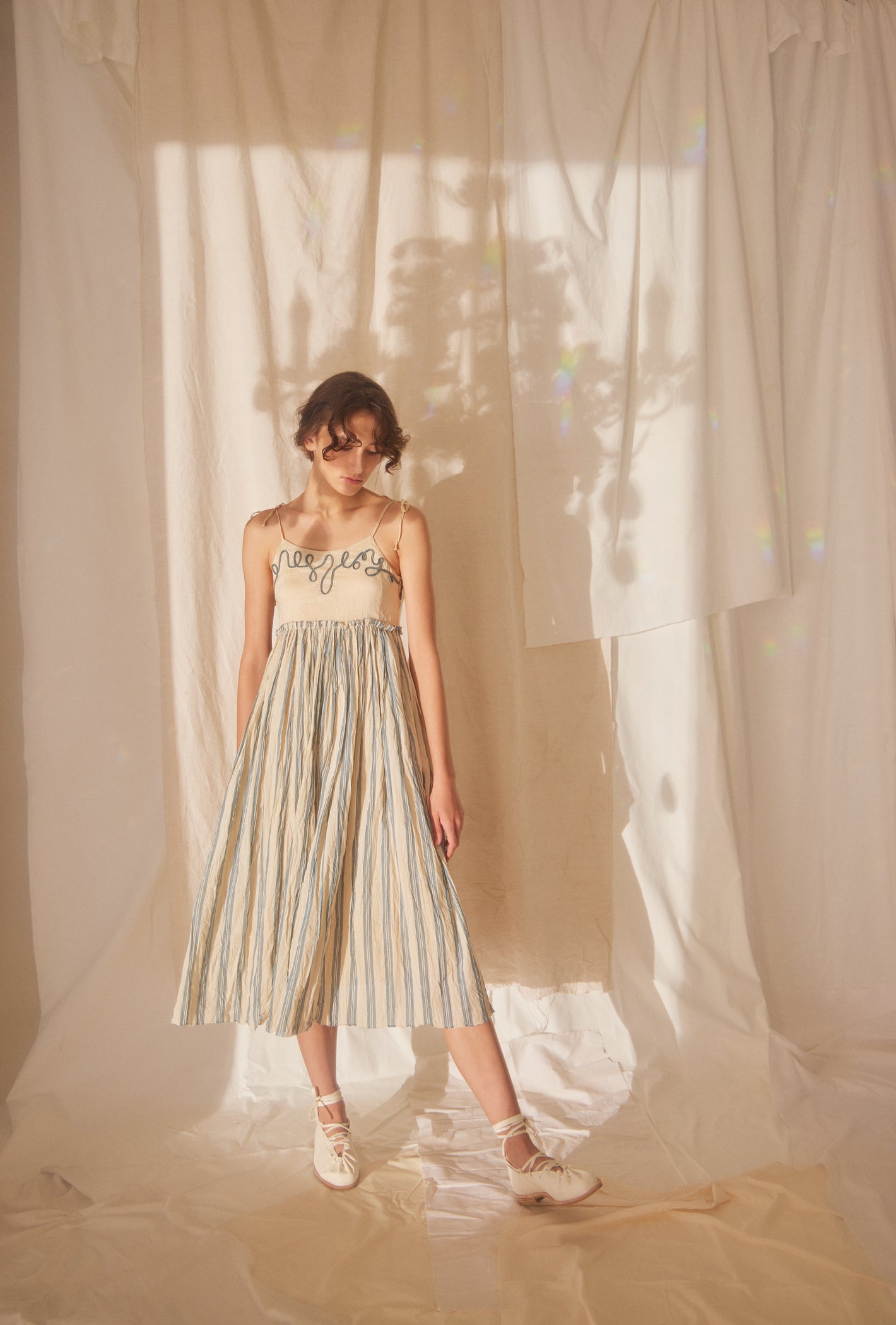 A Tentative Atelier SS22 Lookbook straps embroidered top and striped skirt bottom midi dress