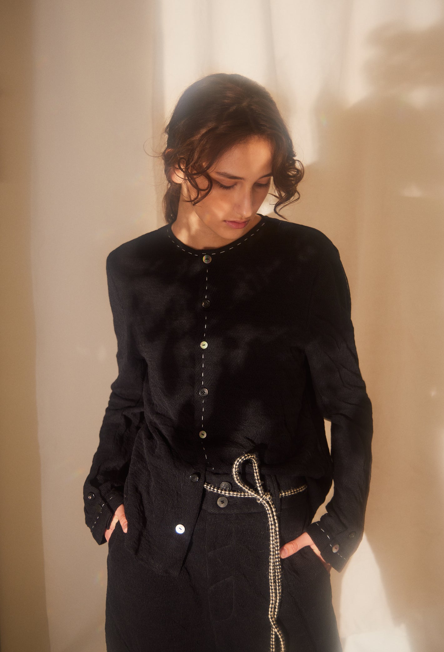 A Tentative Atelier SS22 Lookbook crop of black cardigan
