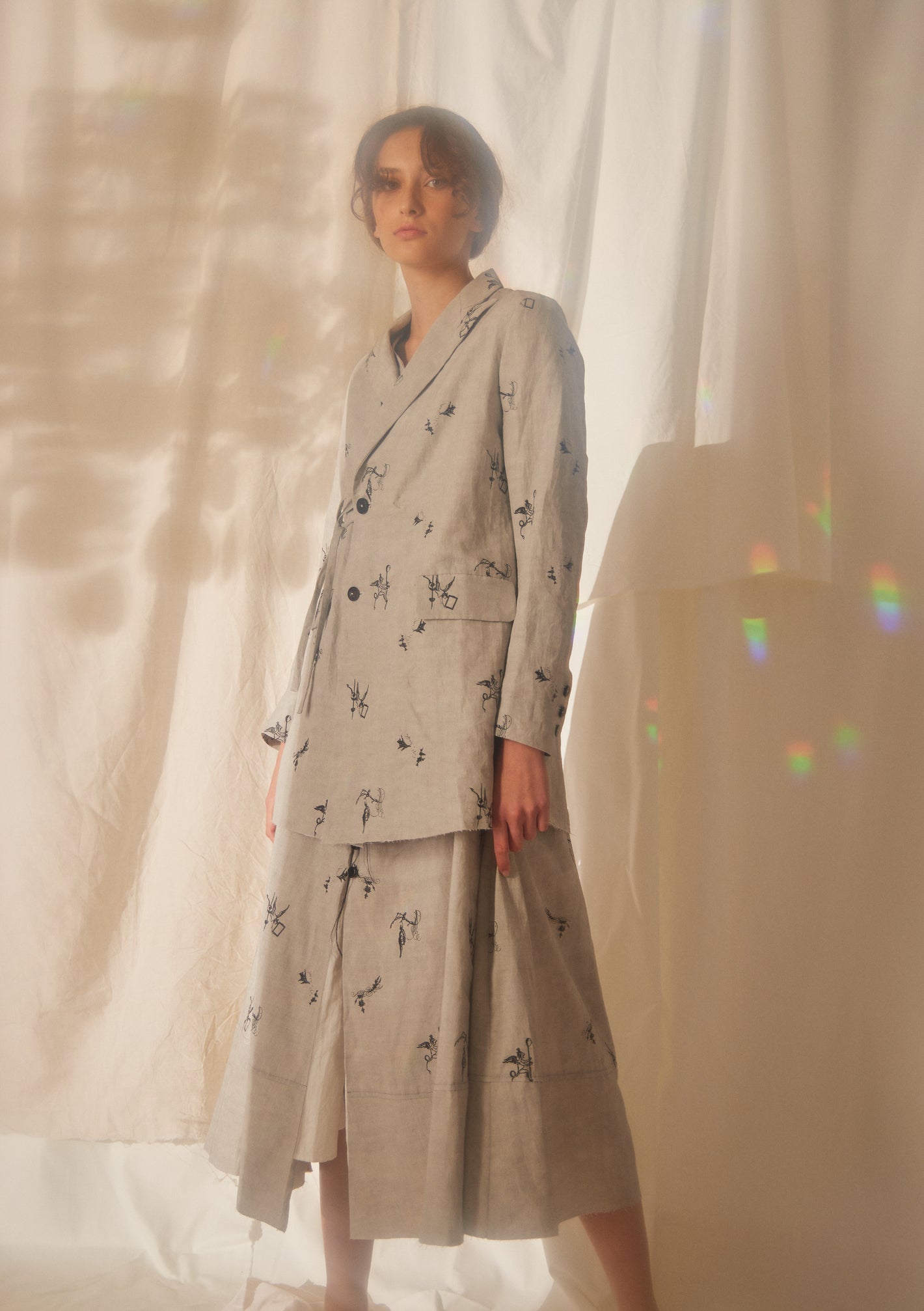 A Tentative Atelier SS22 Lookbook crop of greige embroidered jacket and dress