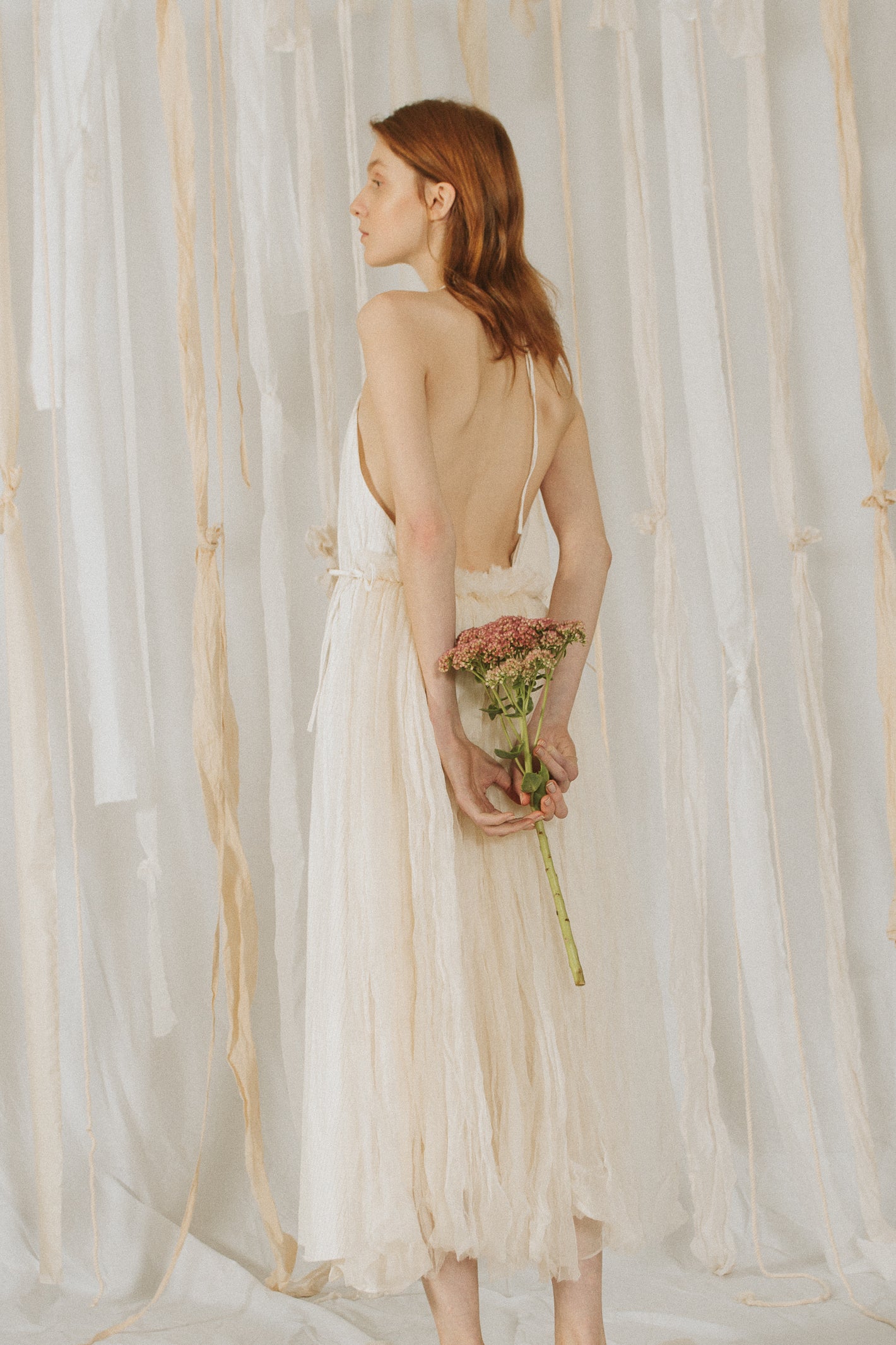 A Tentative Atelier SS18 Lookbook Womens crop of the back of a white tulle halter dress