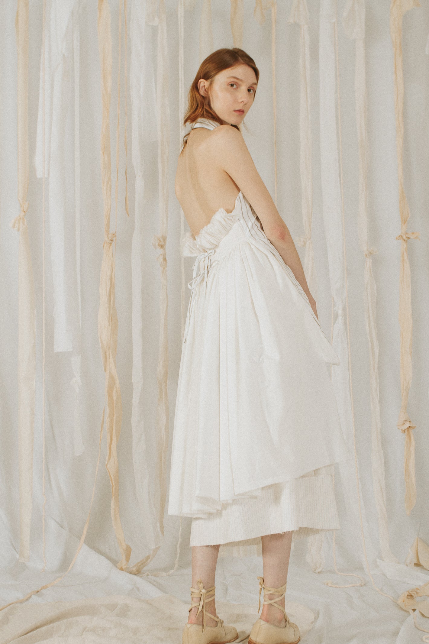 A Tentative Atelier SS18 Lookbook Womens back of a layered white halter neck dress