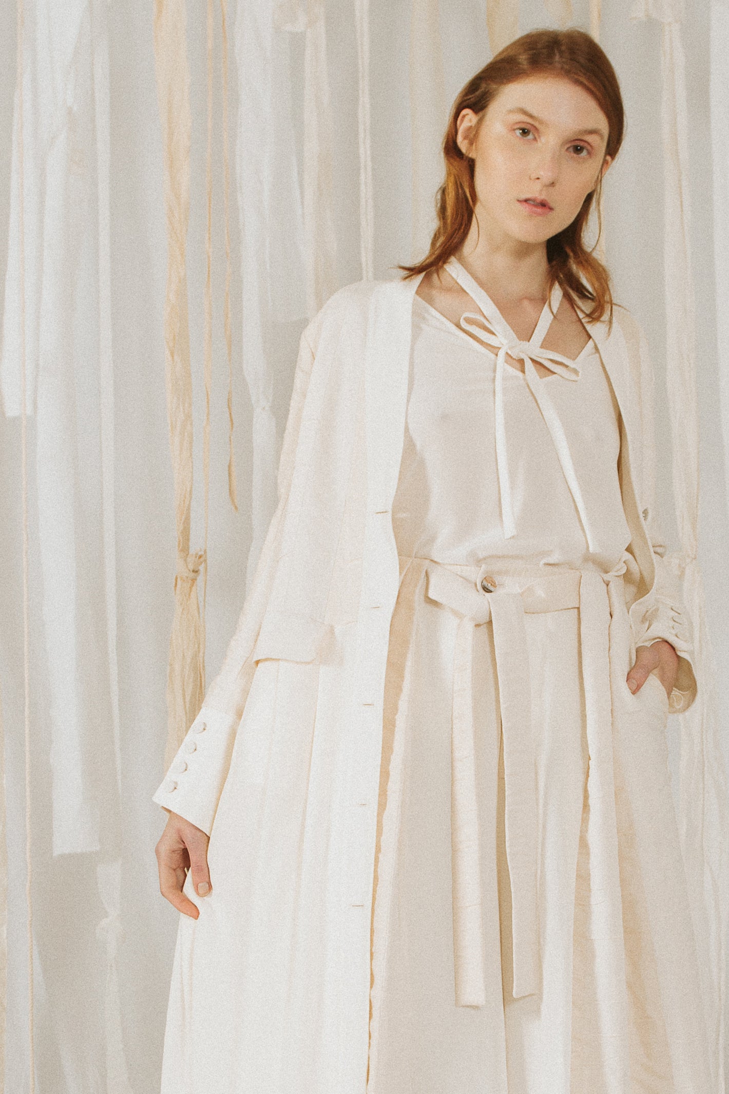 A Tentative Atelier SS18 Lookbook Womens crop of white long coat and white belted trousers