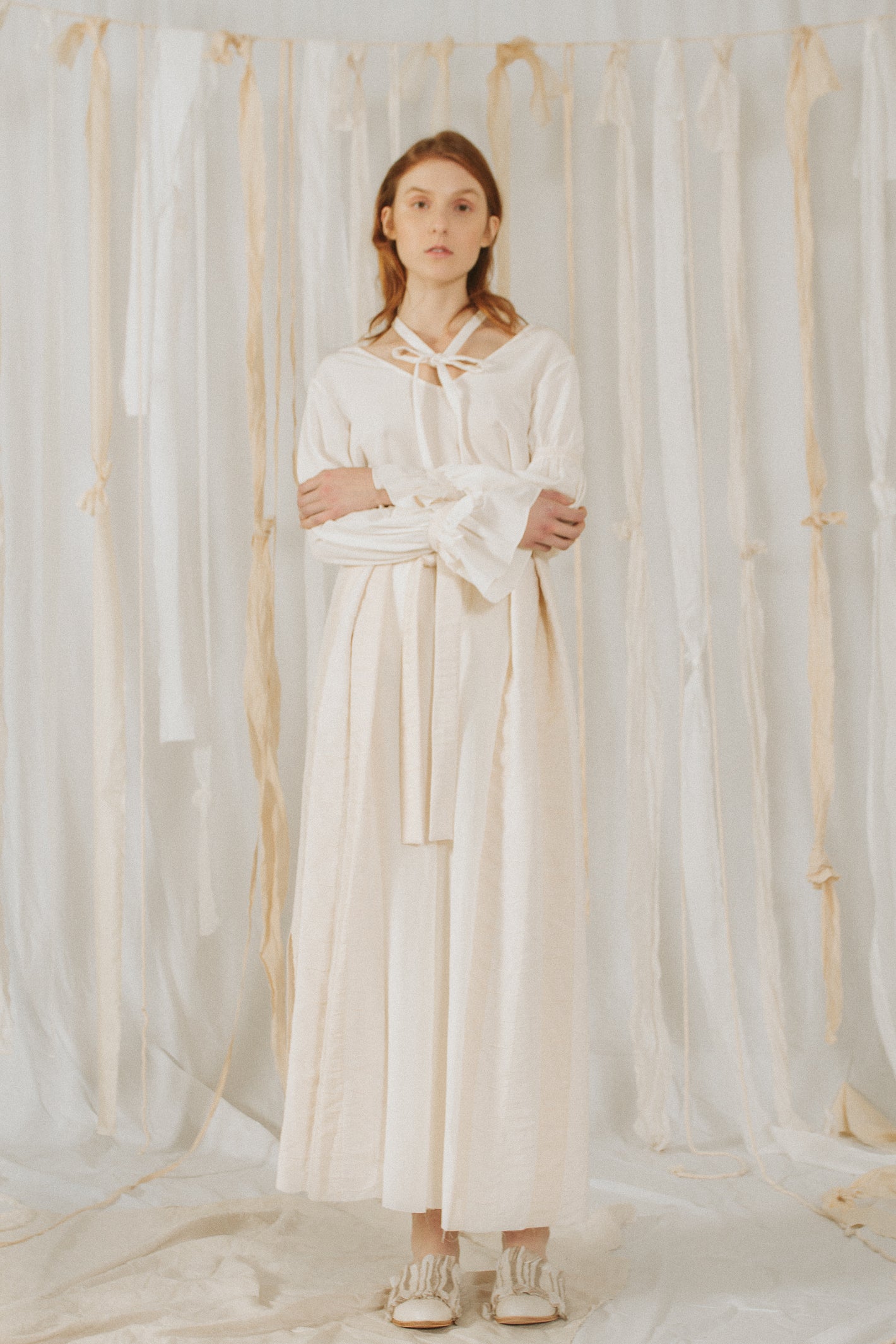 A Tentative Atelier SS18 Lookbook Womens white blouse with neck ties and white high waist belted trousers