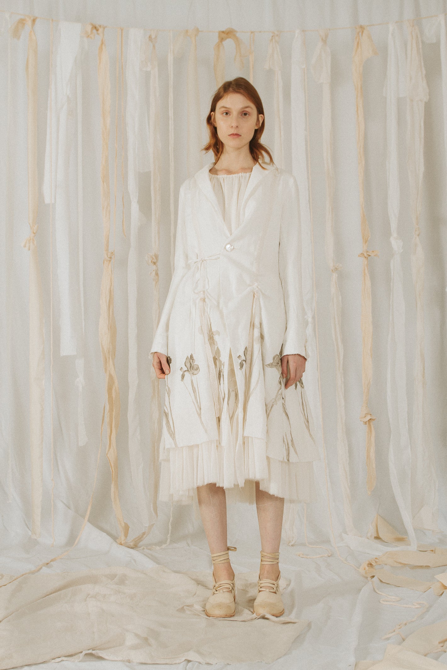 A Tentative Atelier SS18 Lookbook Womens white printed hem coat with high front slits