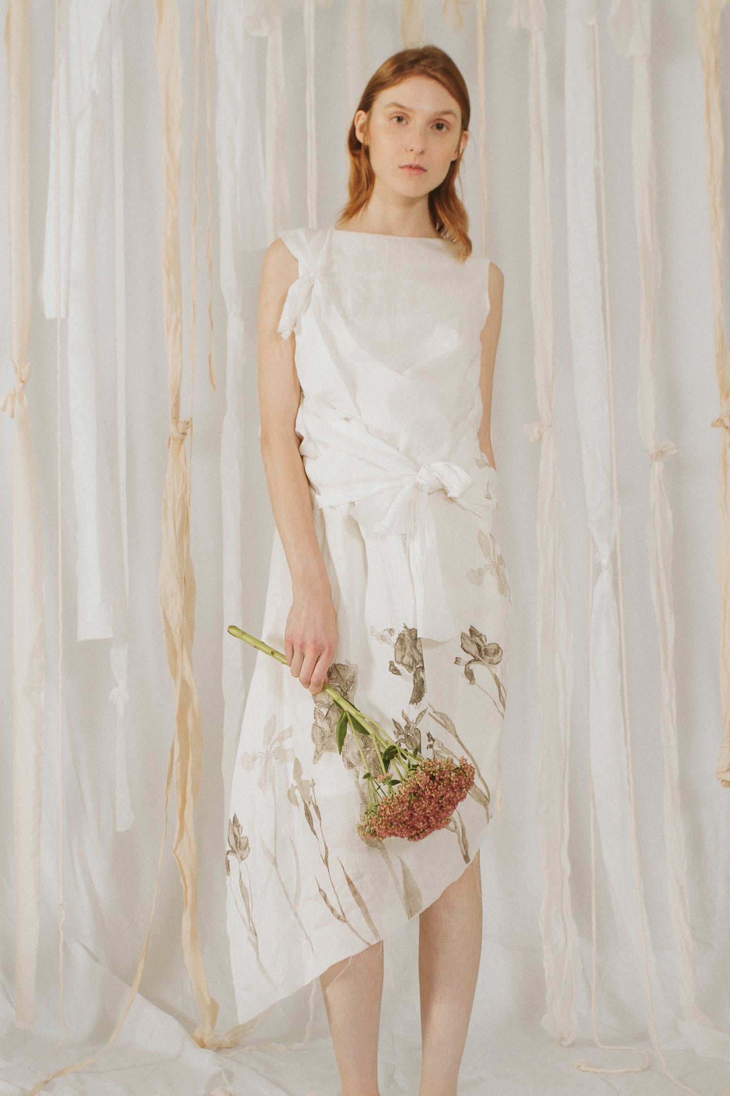 A Tentative Atelier SS18 Lookbook Womens crop of white sleeveless dress with printed hem and tied styling