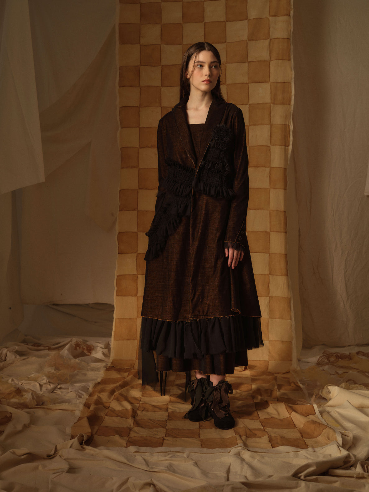 A Tentative Atelier AW21 Lookbook Womens chocolate brown long coat with smocked appliqué