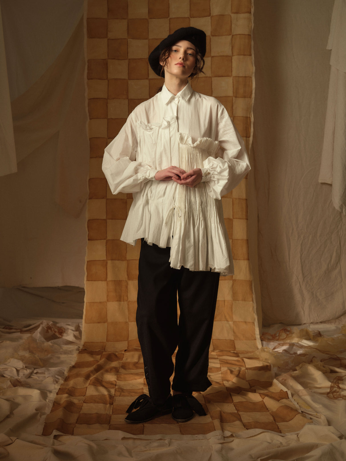 A Tentative Atelier AW21 Lookbook Womens white shirt with oversized sleeves and smocked appliqué on the side body