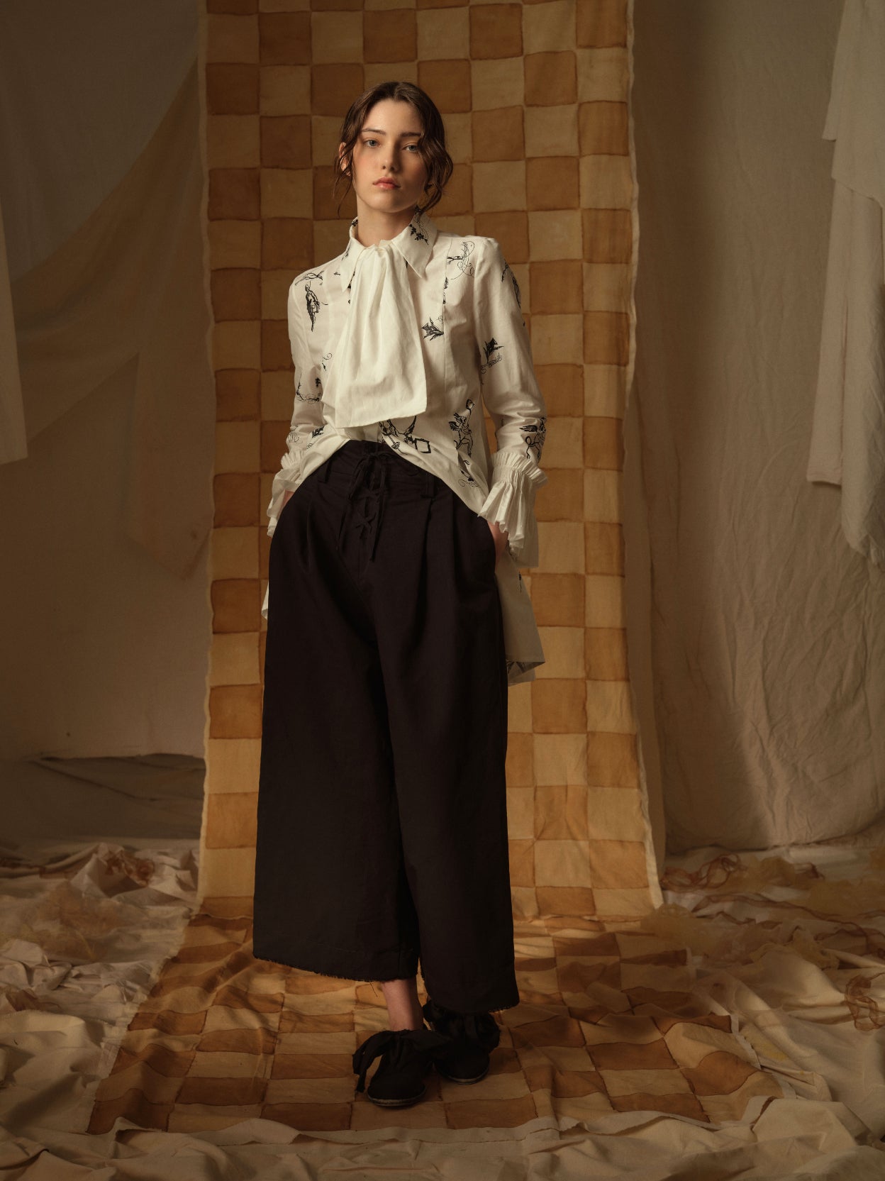 A Tentative Atelier AW21 Lookbook Womens white shirt with cravat style neck and printed black pattern