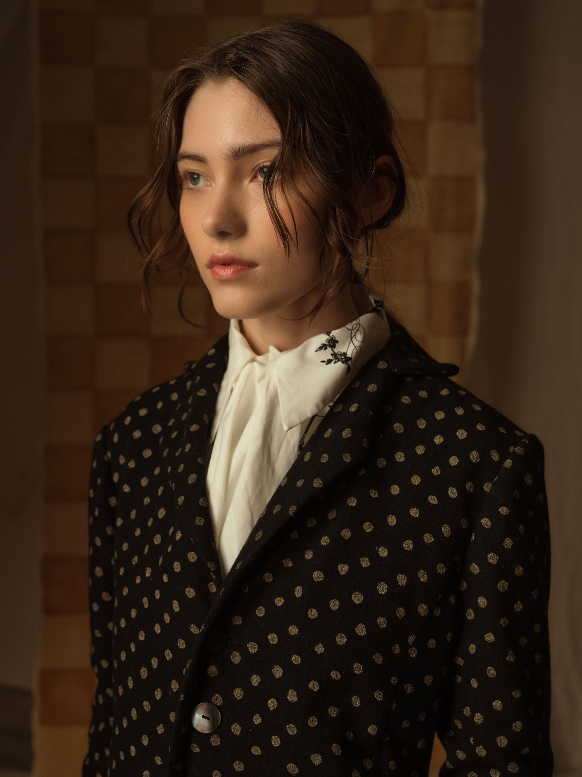 A Tentative Atelier AW21 Lookbook Womens crop of a black patterned coat