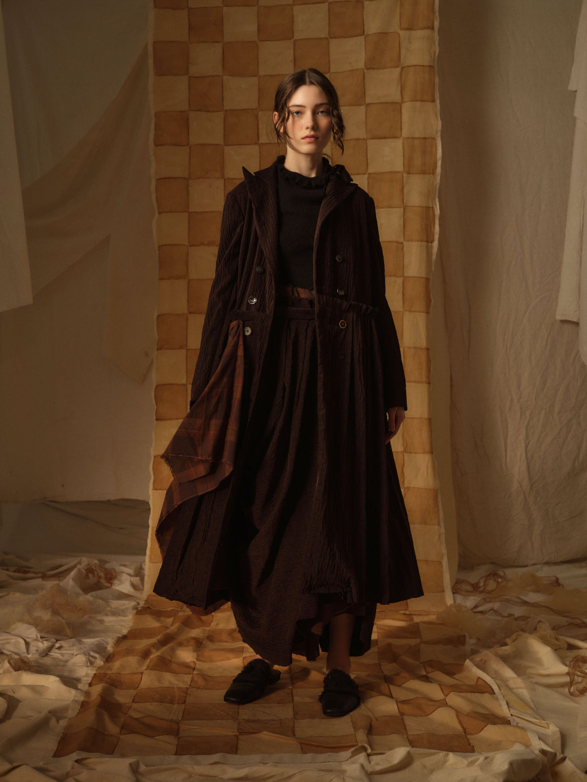 A Tentative Atelier AW21 Lookbook Womens long brown velvet coat with contrasting check draped panel
