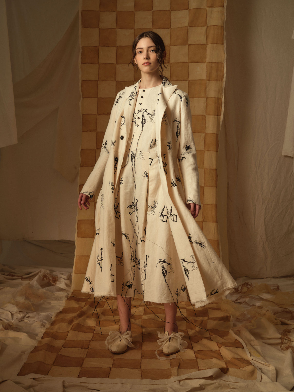 A Tentative Atelier AW21 Lookbook Womens black and white embroidered coat and dress