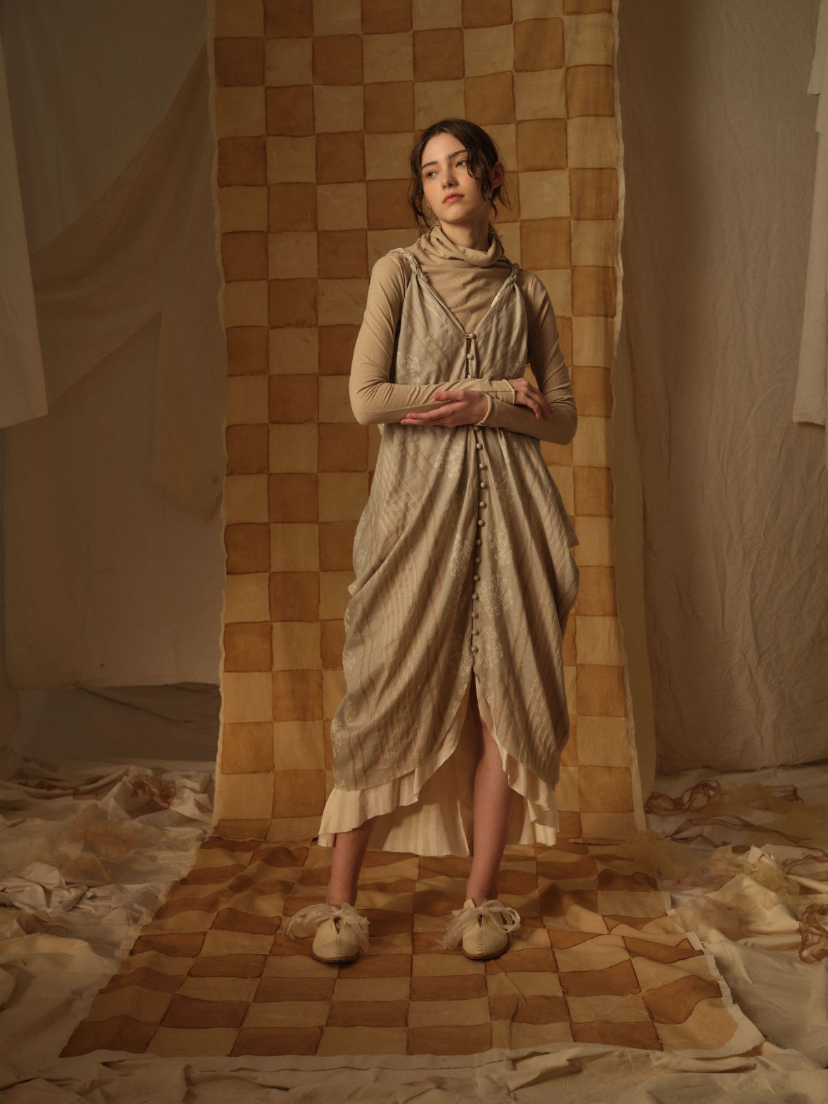 A Tentative Atelier AW21 Lookbook Womens beige striped draped buttoned strap dress with beige turtleneck top