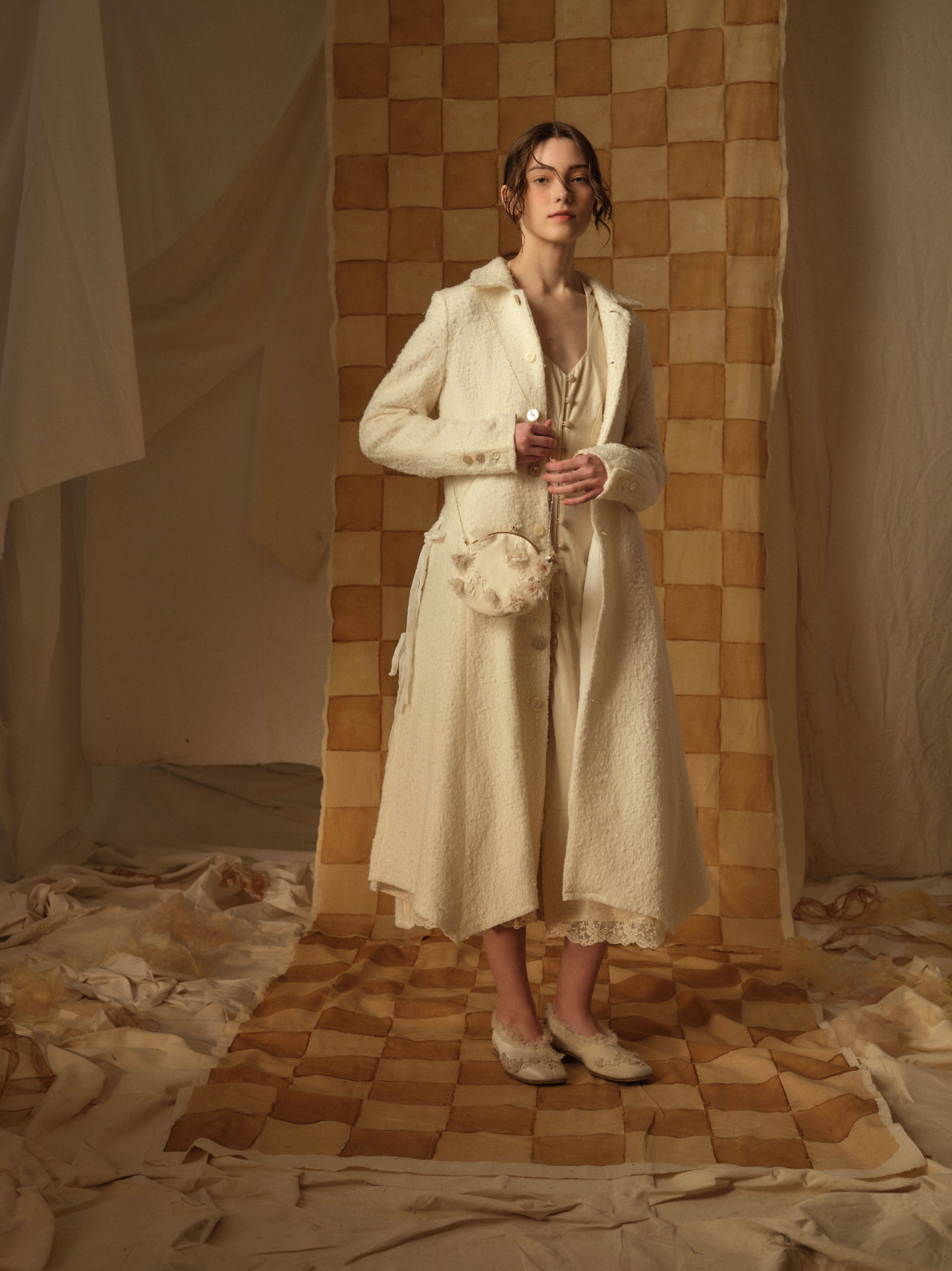 A Tentative Atelier AW21 Lookbook Womens textured white long coat and side body bag