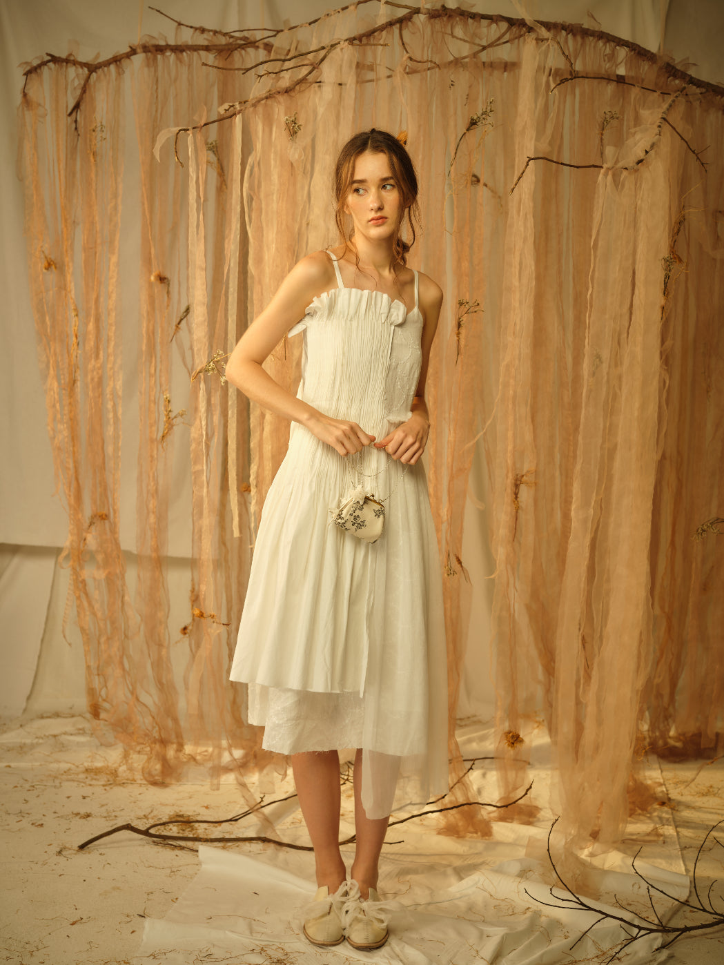 A Tentative Atelier SS21 Lookbook Womens white strap dress with a smocked side panel