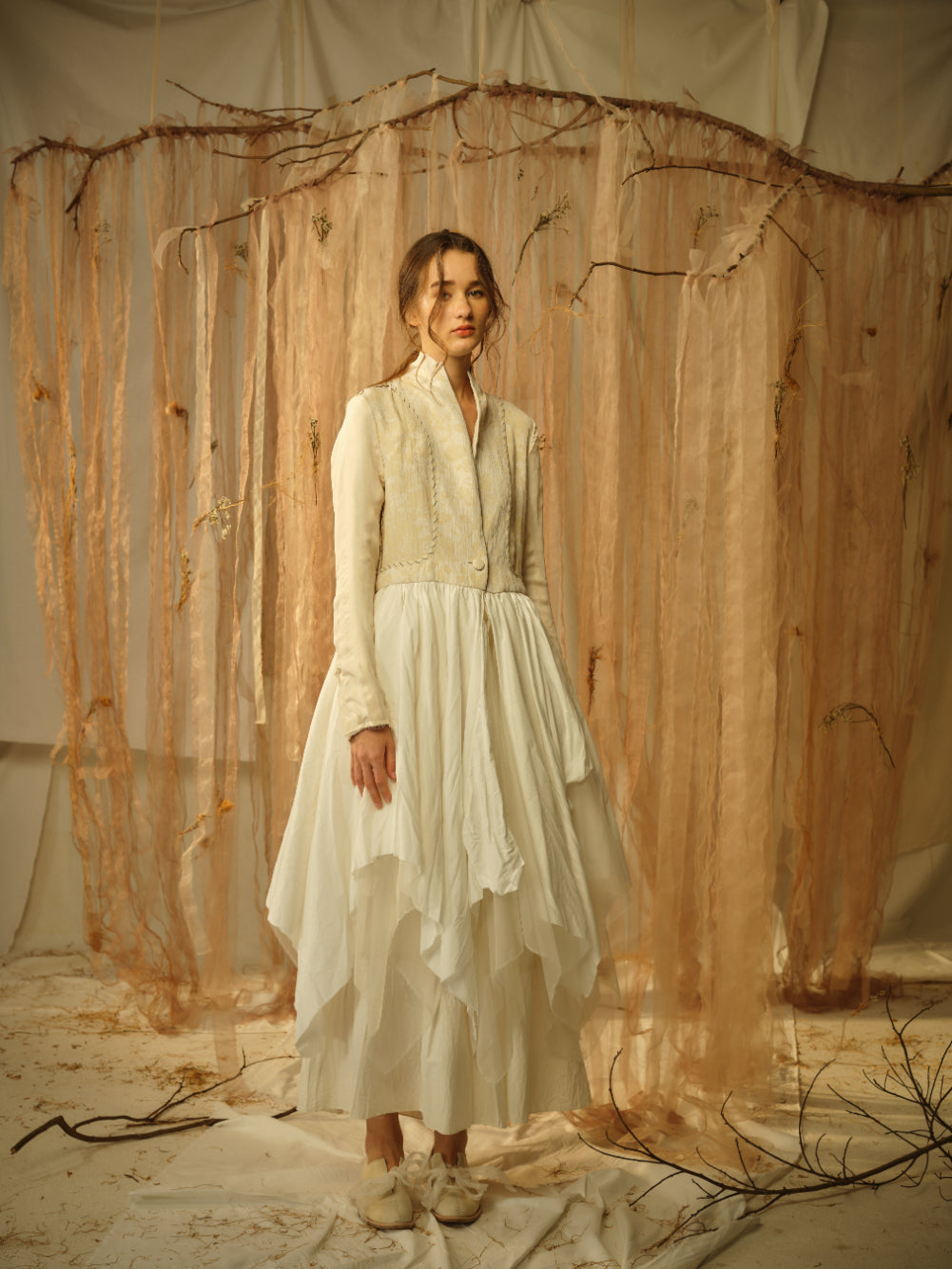 A Tentative Atelier SS21 Lookbook Womens beige and white dress coat with a multi layered skirt