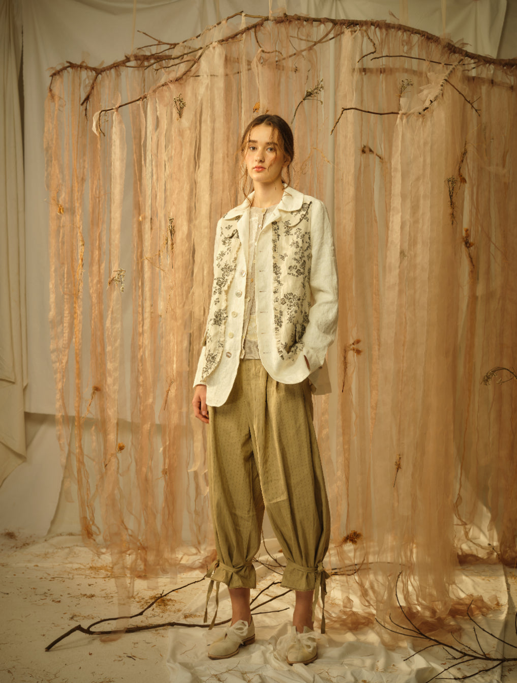 A Tentative Atelier SS21 Lookbook Womens floral print and white jacket with brown ruched bottom trousers