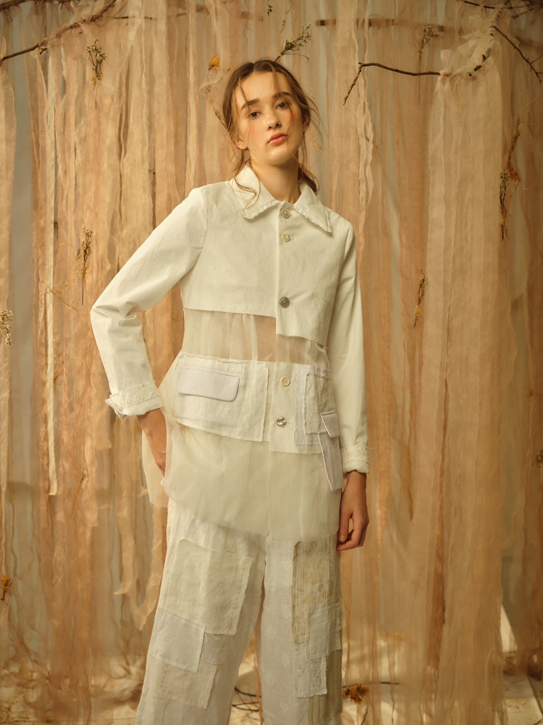 A Tentative Atelier SS21 Lookbook Womens crop of a white patchwork jacket with sheer panel
